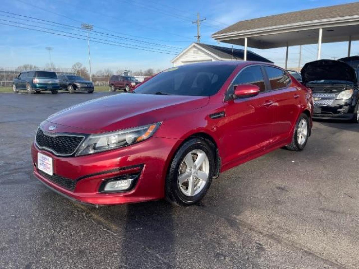 2014 Remington Red Metallic Kia Optima LX (5XXGM4A72EG) with an 2.4L L4 DOHC 16V engine, 6-Speed Automatic transmission, located at 401 Woodman Dr, Riverside, OH, 45431, (937) 908-9800, 39.760899, -84.123421 - Photo#1