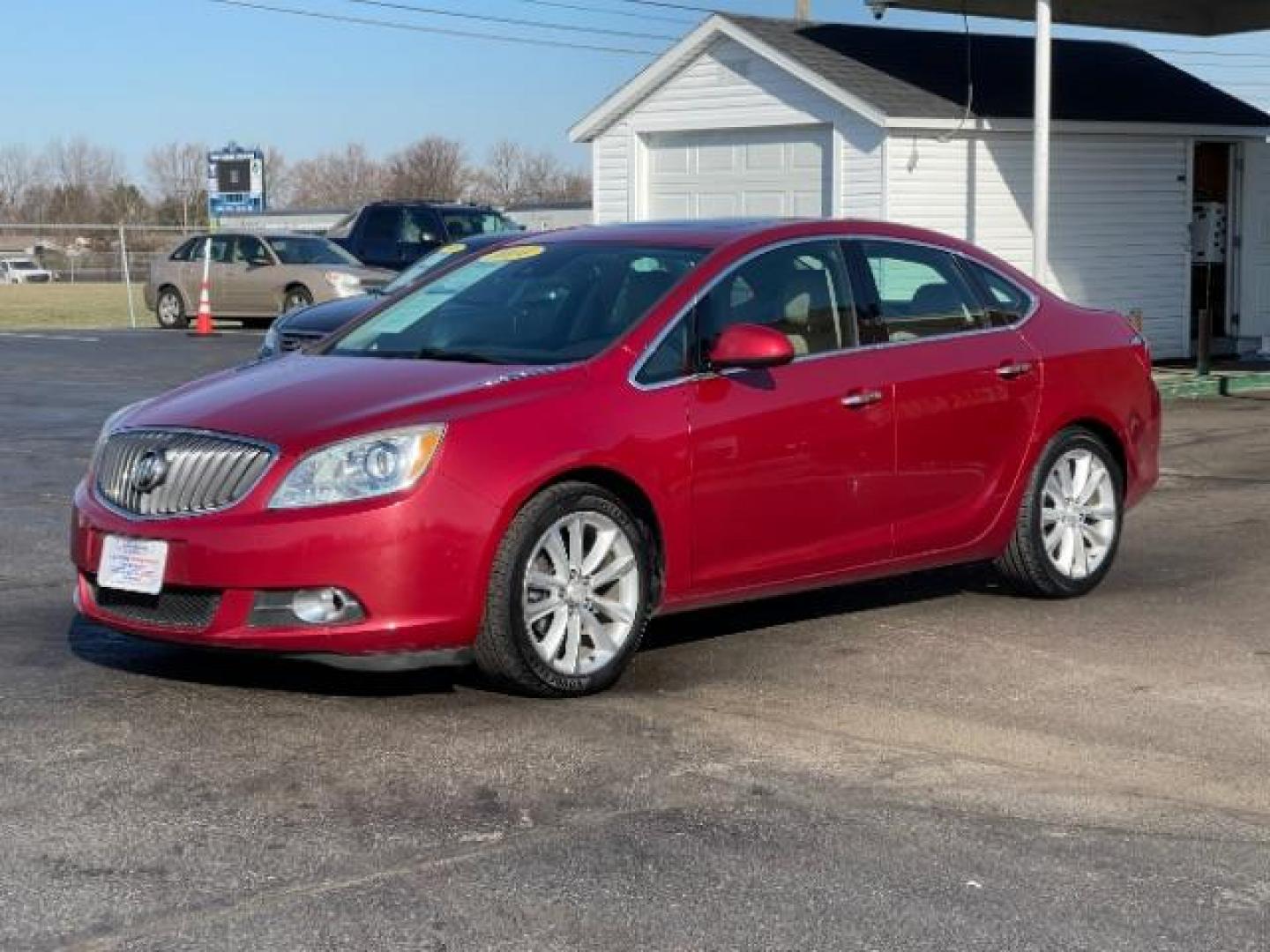 2015 Crystal Red Tintcoat Buick Verano Leather (1G4PS5SK5F4) with an 2.4L L4 DOHC 16V FFV engine, 6-Speed Automatic transmission, located at 1184 Kauffman Ave, Fairborn, OH, 45324, (937) 908-9800, 39.807072, -84.030914 - Photo#1