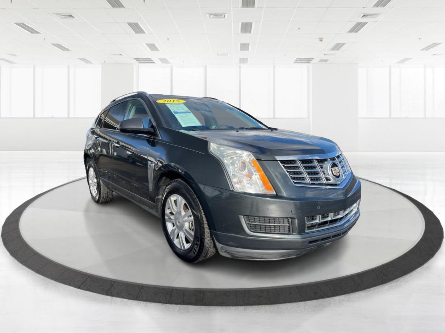 2015 Graphite Metallic Cadillac SRX Luxury Collection FWD (3GYFNBE3XFS) with an 3.6L V6 DOHC 24V FFV engine, 6-Speed Automatic transmission, located at 880 E. National Road, Vandalia, OH, 45377, (937) 908-9800, 39.891918, -84.183594 - Photo#0