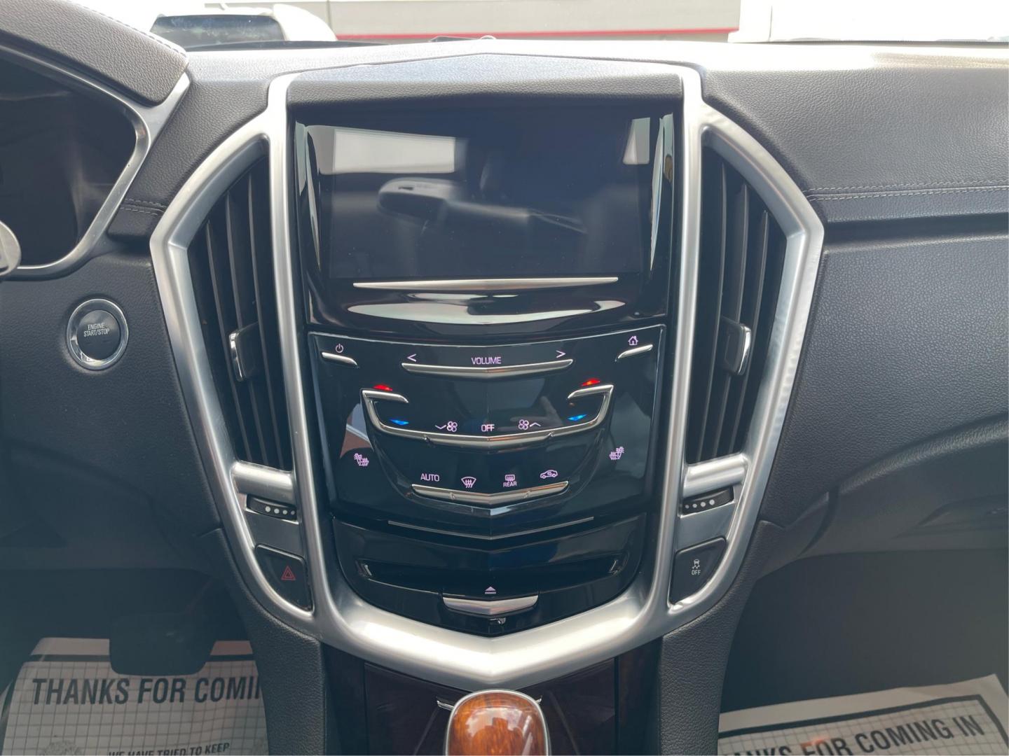 2015 Graphite Metallic Cadillac SRX Luxury Collection FWD (3GYFNBE3XFS) with an 3.6L V6 DOHC 24V FFV engine, 6-Speed Automatic transmission, located at 880 E. National Road, Vandalia, OH, 45377, (937) 908-9800, 39.891918, -84.183594 - Photo#12