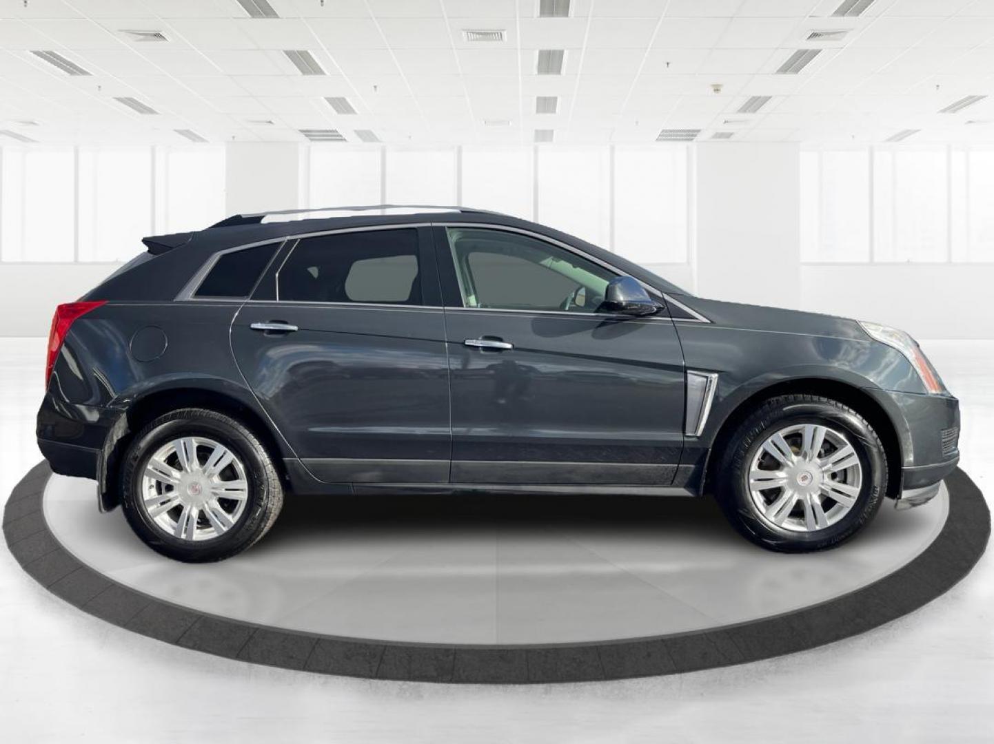 2015 Graphite Metallic Cadillac SRX Luxury Collection FWD (3GYFNBE3XFS) with an 3.6L V6 DOHC 24V FFV engine, 6-Speed Automatic transmission, located at 880 E. National Road, Vandalia, OH, 45377, (937) 908-9800, 39.891918, -84.183594 - Photo#1