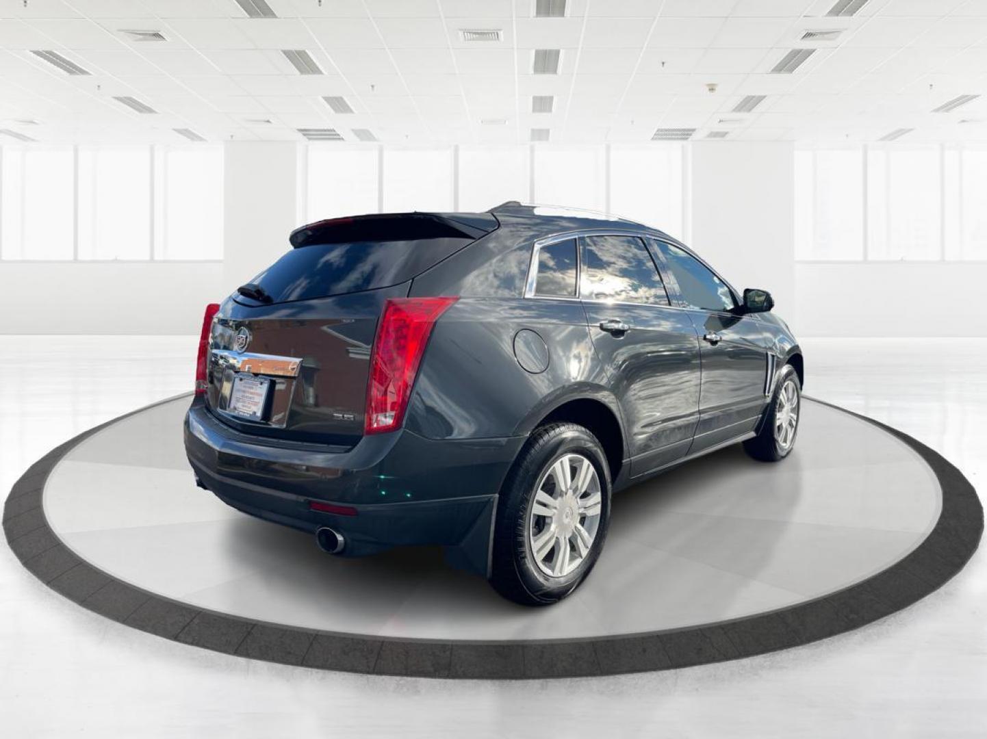 2015 Graphite Metallic Cadillac SRX Luxury Collection FWD (3GYFNBE3XFS) with an 3.6L V6 DOHC 24V FFV engine, 6-Speed Automatic transmission, located at 880 E. National Road, Vandalia, OH, 45377, (937) 908-9800, 39.891918, -84.183594 - Photo#2