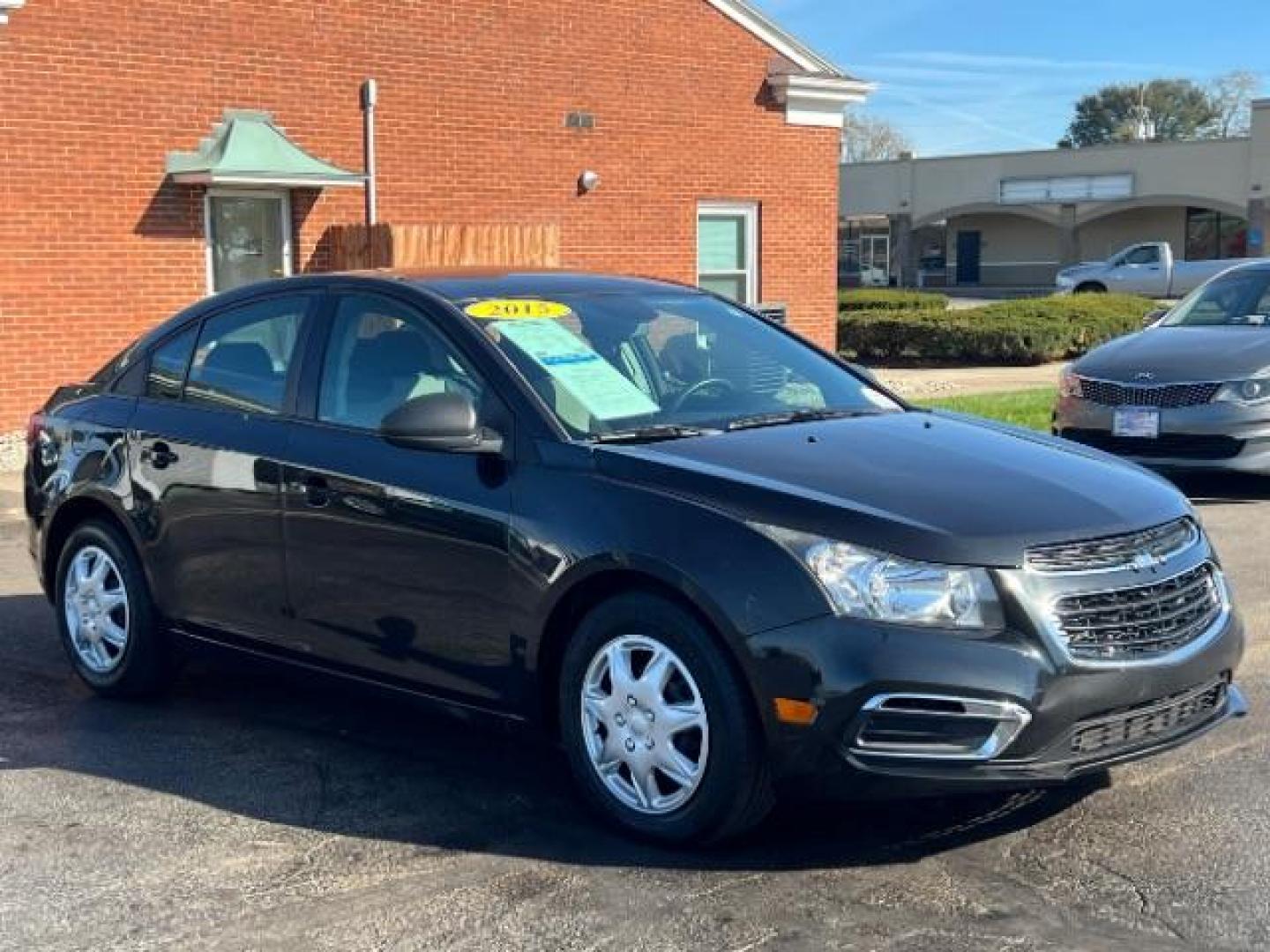 2015 Black Granite Metallic Chevrolet Cruze LS Auto (1G1PA5SHXF7) with an 1.8L L4 DOHC 16V FFV engine, 6-Speed Automatic transmission, located at 880 E. National Road, Vandalia, OH, 45377, (937) 908-9800, 39.891918, -84.183594 - Photo#0