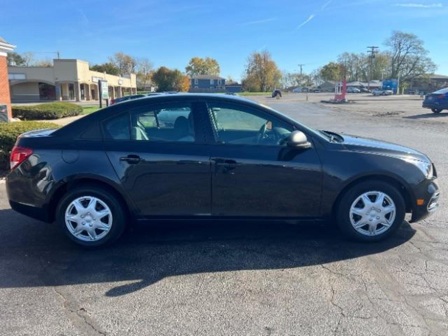 2015 Black Granite Metallic Chevrolet Cruze LS Auto (1G1PA5SHXF7) with an 1.8L L4 DOHC 16V FFV engine, 6-Speed Automatic transmission, located at 880 E. National Road, Vandalia, OH, 45377, (937) 908-9800, 39.891918, -84.183594 - Photo#5