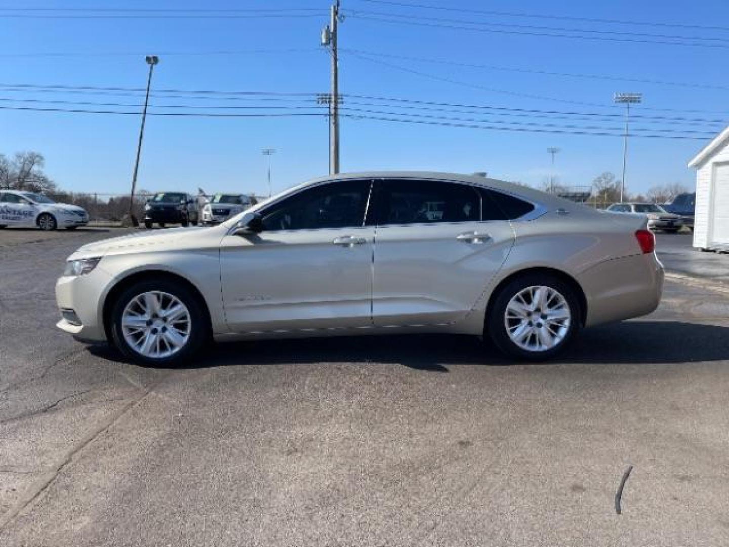 2015 Champagne Silver Metallic Chevrolet Impala LS (2G11Z5SL2F9) with an 2.5L L4 DOHC 16V engine, 6-Speed Automatic transmission, located at 1184 Kauffman Ave, Fairborn, OH, 45324, (937) 908-9800, 39.807072, -84.030914 - Photo#2