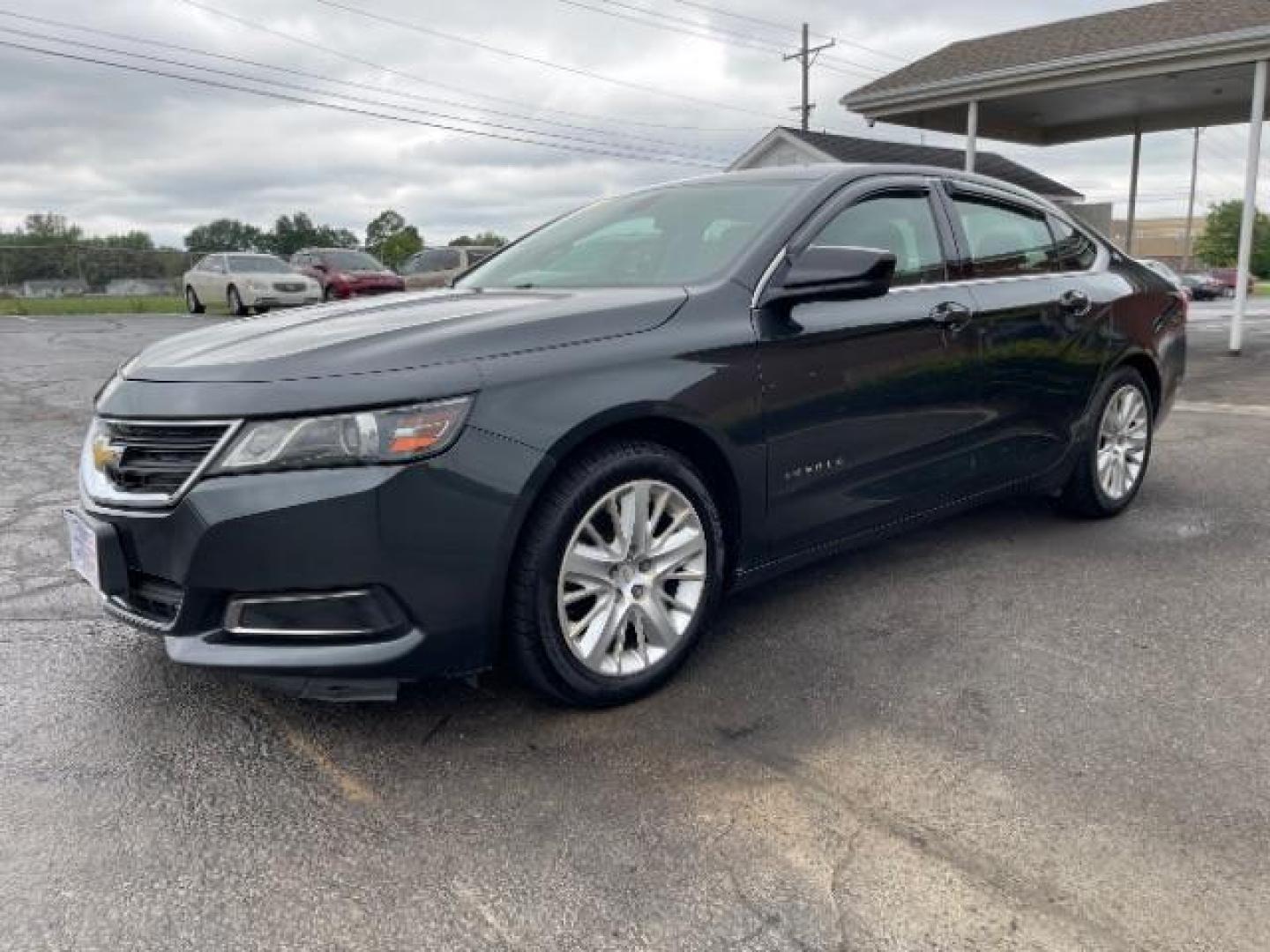 2015 Black Chevrolet Impala LS (2G11Z5SL6F9) with an 2.5L L4 DOHC 16V engine, 6-Speed Automatic transmission, located at 1099 N County Rd 25A , Troy, OH, 45373, (937) 908-9800, 40.057079, -84.212883 - Photo#1