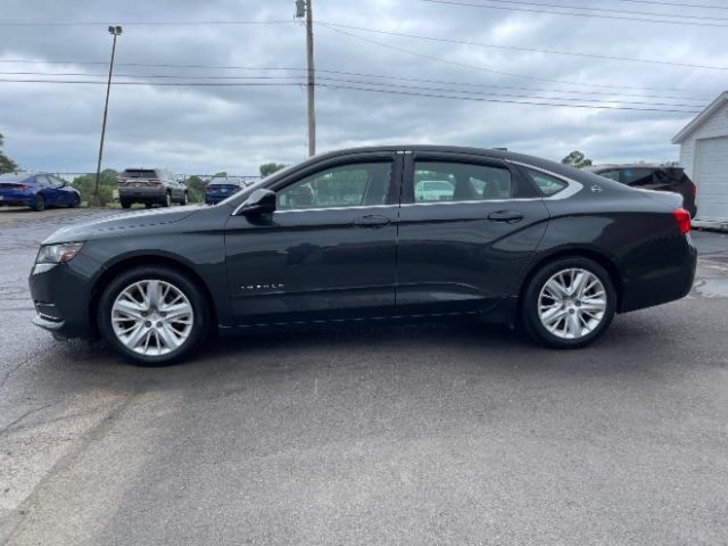 2015 Black Chevrolet Impala LS (2G11Z5SL6F9) with an 2.5L L4 DOHC 16V engine, 6-Speed Automatic transmission, located at 1099 N County Rd 25A , Troy, OH, 45373, (937) 908-9800, 40.057079, -84.212883 - Photo#2