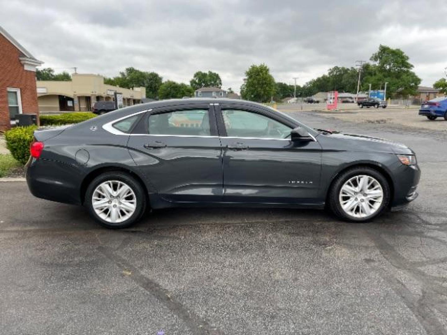 2015 Black Chevrolet Impala LS (2G11Z5SL6F9) with an 2.5L L4 DOHC 16V engine, 6-Speed Automatic transmission, located at 1099 N County Rd 25A , Troy, OH, 45373, (937) 908-9800, 40.057079, -84.212883 - Photo#3