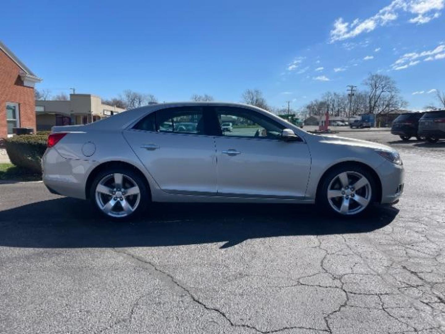 2015 Champagne Silver Metallic Chevrolet Malibu 2LTZ (1G11G5SX9FF) with an 2.0L L4 DOHC 16V engine, 6-Speed Automatic transmission, located at 1951 S Dayton Lakeview Rd., New Carlisle, OH, 45344, (937) 908-9800, 39.890999, -84.050255 - Photo#3