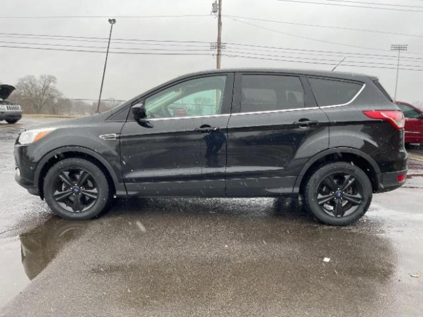 2015 Tuxedo Black Metallic Ford Escape SE FWD (1FMCU0G78FU) with an 2.5L L4 DOHC 16V engine, 6-Speed Automatic transmission, located at 1230 East Main St, Xenia, OH, 45385, (937) 908-9800, 39.688026, -83.910172 - Photo#2