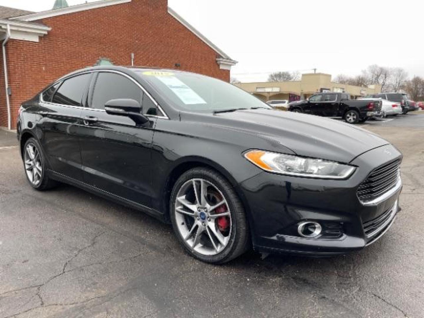 2015 Tuxedo Black Ford Fusion Titanium (3FA6P0K99FR) with an 2.0L L4 DOHC 16V engine, 6-Speed Automatic transmission, located at 401 Woodman Dr, Riverside, OH, 45431, (937) 908-9800, 39.760899, -84.123421 - Photo#0