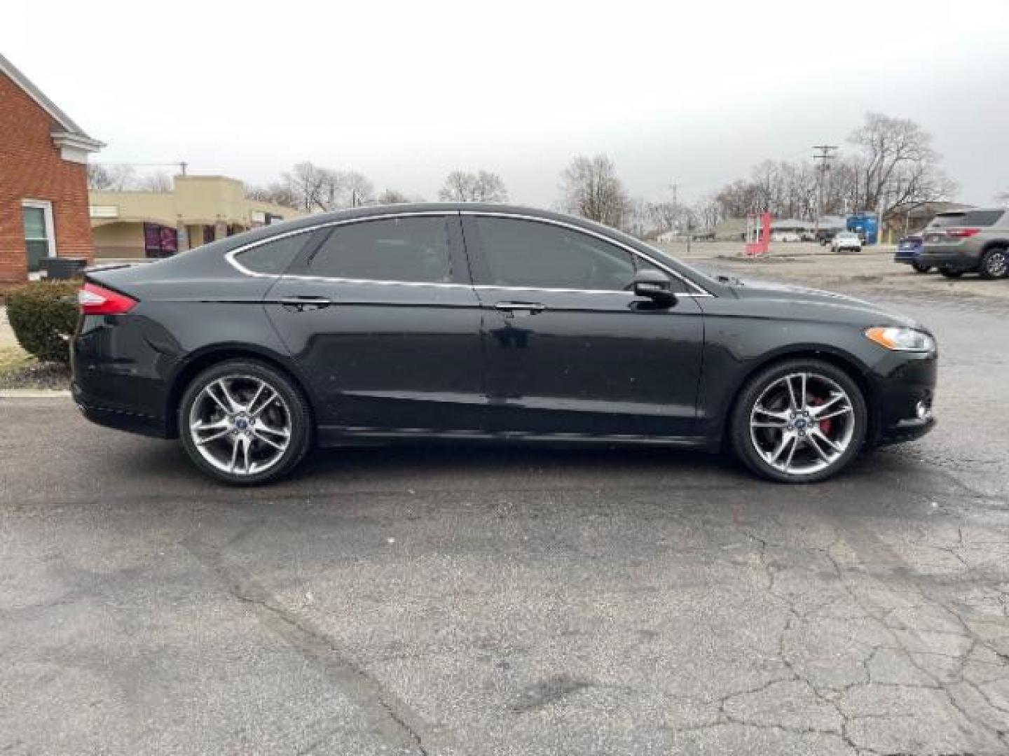 2015 Tuxedo Black Ford Fusion Titanium (3FA6P0K99FR) with an 2.0L L4 DOHC 16V engine, 6-Speed Automatic transmission, located at 401 Woodman Dr, Riverside, OH, 45431, (937) 908-9800, 39.760899, -84.123421 - Photo#3