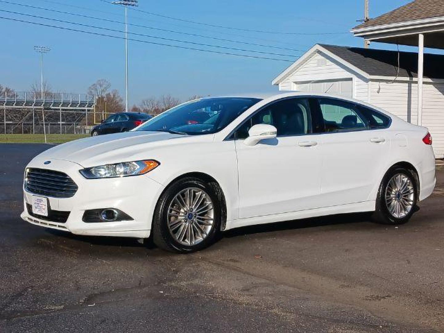 2015 White Platinum Met TC Ford Fusion SE (3FA6P0HD5FR) with an 1.5L L4 DOHC 16V engine, 6-Speed Automatic transmission, located at 1951 S Dayton Lakeview Rd., New Carlisle, OH, 45344, (937) 908-9800, 39.890999, -84.050255 - Photo#2