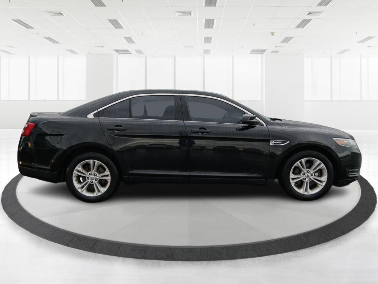 2015 Tuxedo Black Metallic Ford Taurus SEL FWD (1FAHP2E80FG) with an 3.5L V6 DOHC 24V engine, 6-Speed Automatic transmission, located at 4508 South Dixie Dr, Moraine, OH, 45439, (937) 908-9800, 39.689976, -84.218452 - Photo#1