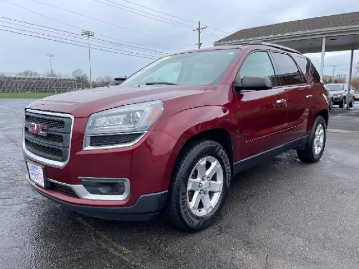 2015 Crimson Red Tincoat GMC Acadia SLE-2 AWD (1GKKVPKDXFJ) with an 3.6L V6 DOHC 24V engine, 6-Speed Automatic transmission, located at 1099 N County Rd 25A , Troy, OH, 45373, (937) 908-9800, 40.057079, -84.212883 - Photo#1