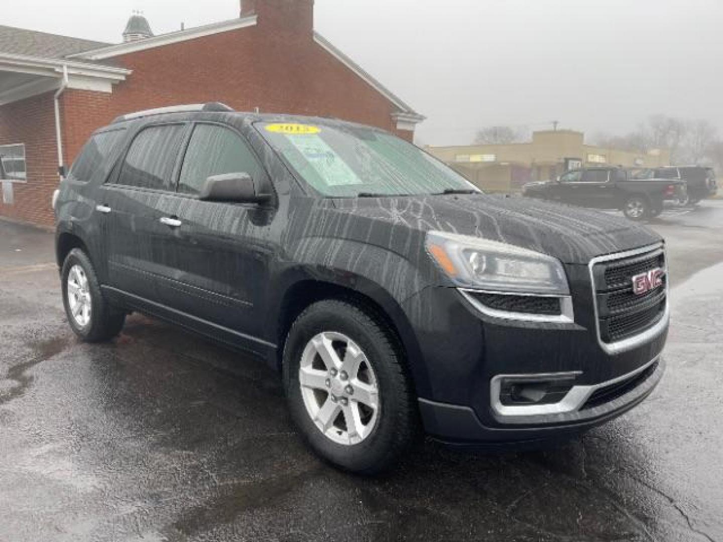 2015 Carbon Black Metallic GMC Acadia SLE-2 FWD (1GKKRPKD3FJ) with an 3.6L V6 DOHC 24V engine, 6-Speed Automatic transmission, located at 1099 N County Rd 25A , Troy, OH, 45373, (937) 908-9800, 40.057079, -84.212883 - Photo#0