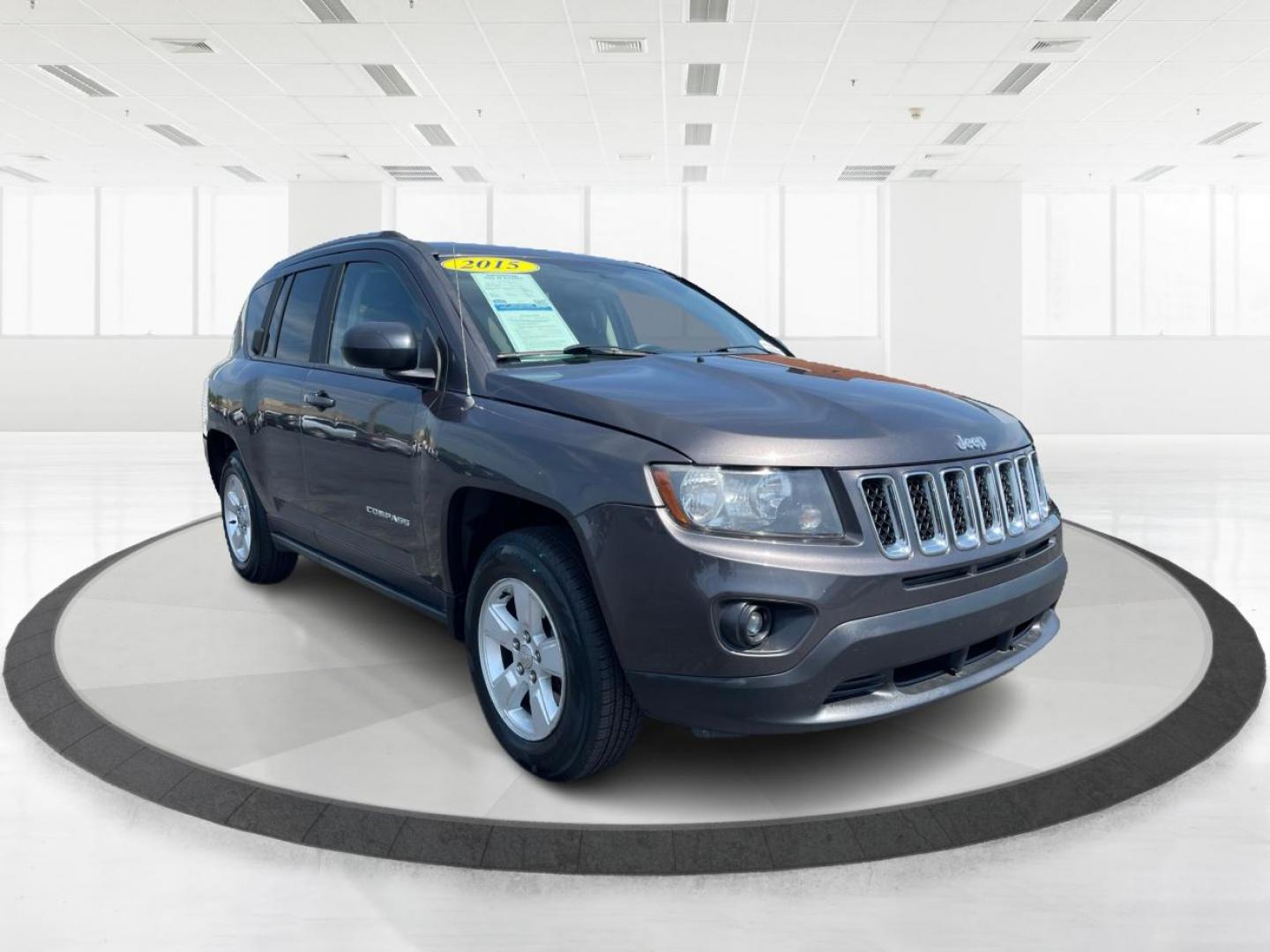 2015 Granite Crystal Metallic Clear Coat Jeep Compass Sport FWD (1C4NJCBA1FD) with an 2.0L L4 DOHC 16V engine, located at 1951 S Dayton Lakeview Rd., New Carlisle, OH, 45344, (937) 908-9800, 39.890999, -84.050255 - 2015 Jeep Compass Sport FWD - Photo#0