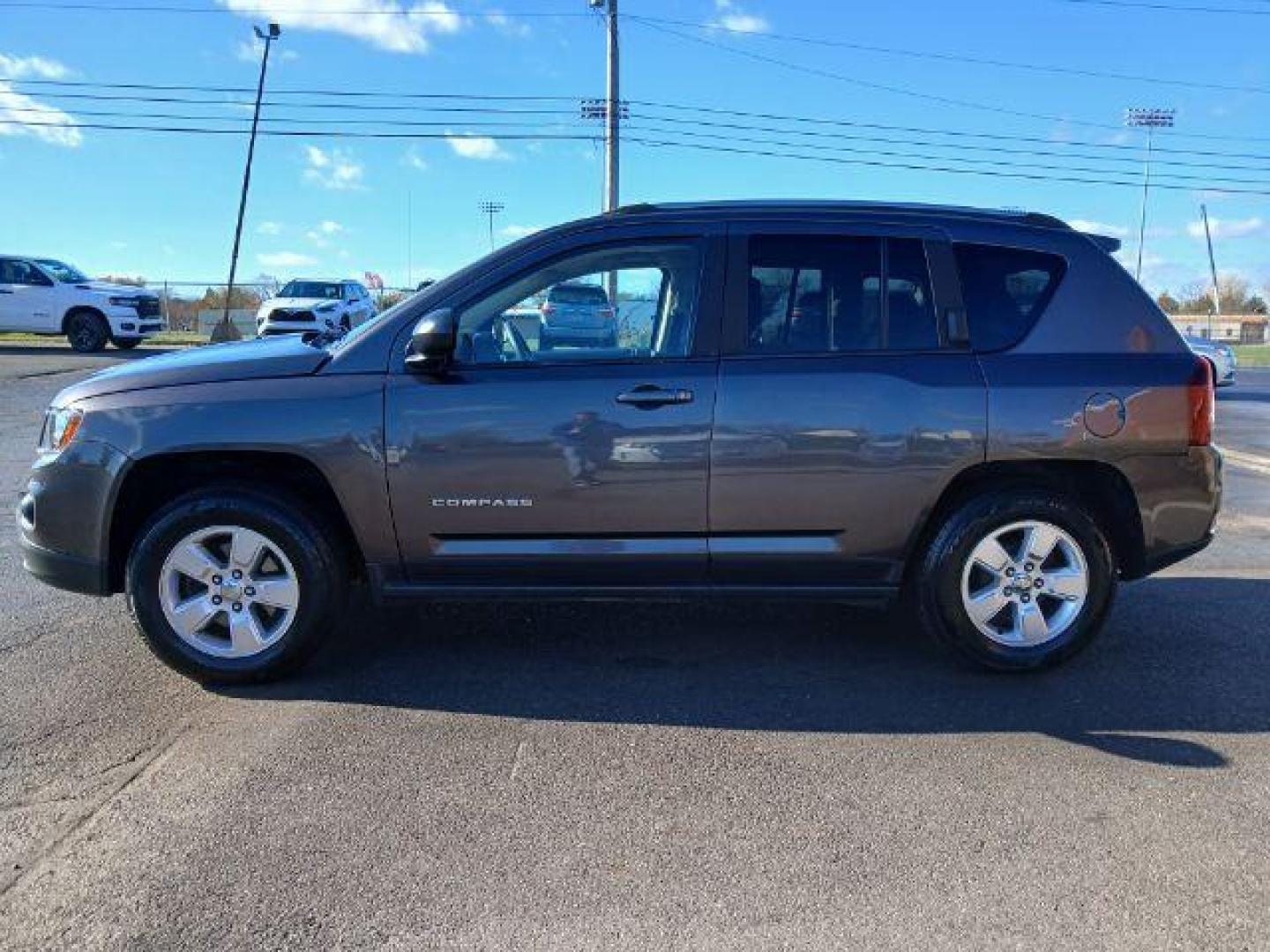 2015 Granite Crystal Metallic Clear Coat Jeep Compass Sport FWD (1C4NJCBA1FD) with an 2.0L L4 DOHC 16V engine, located at 1951 S Dayton Lakeview Rd., New Carlisle, OH, 45344, (937) 908-9800, 39.890999, -84.050255 - 2015 Jeep Compass Sport FWD - Photo#21