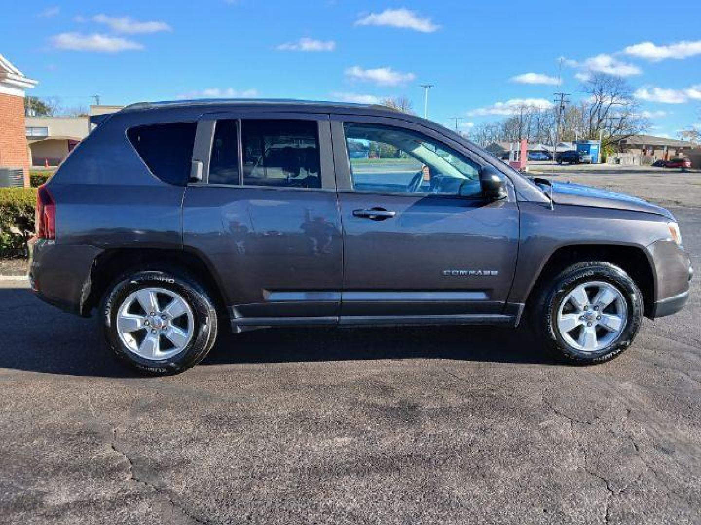 2015 Granite Crystal Metallic Clear Coat Jeep Compass Sport FWD (1C4NJCBA1FD) with an 2.0L L4 DOHC 16V engine, located at 1951 S Dayton Lakeview Rd., New Carlisle, OH, 45344, (937) 908-9800, 39.890999, -84.050255 - 2015 Jeep Compass Sport FWD - Photo#22