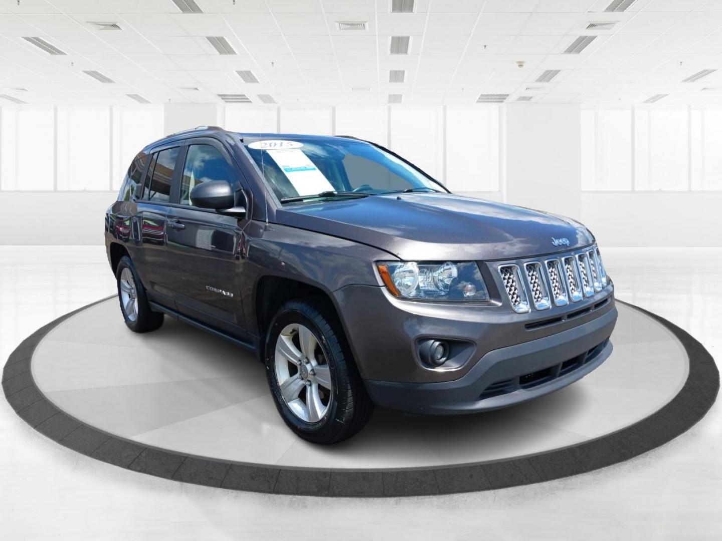 2015 Granite Crystal Metallic Clear Coat Jeep Compass (1C4NJDEB4FD) with an 2.4L L4 DOHC 16V engine, 6-Speed Automatic transmission, located at 1099 N County Rd 25A , Troy, OH, 45373, (937) 908-9800, 40.057079, -84.212883 - Photo#0