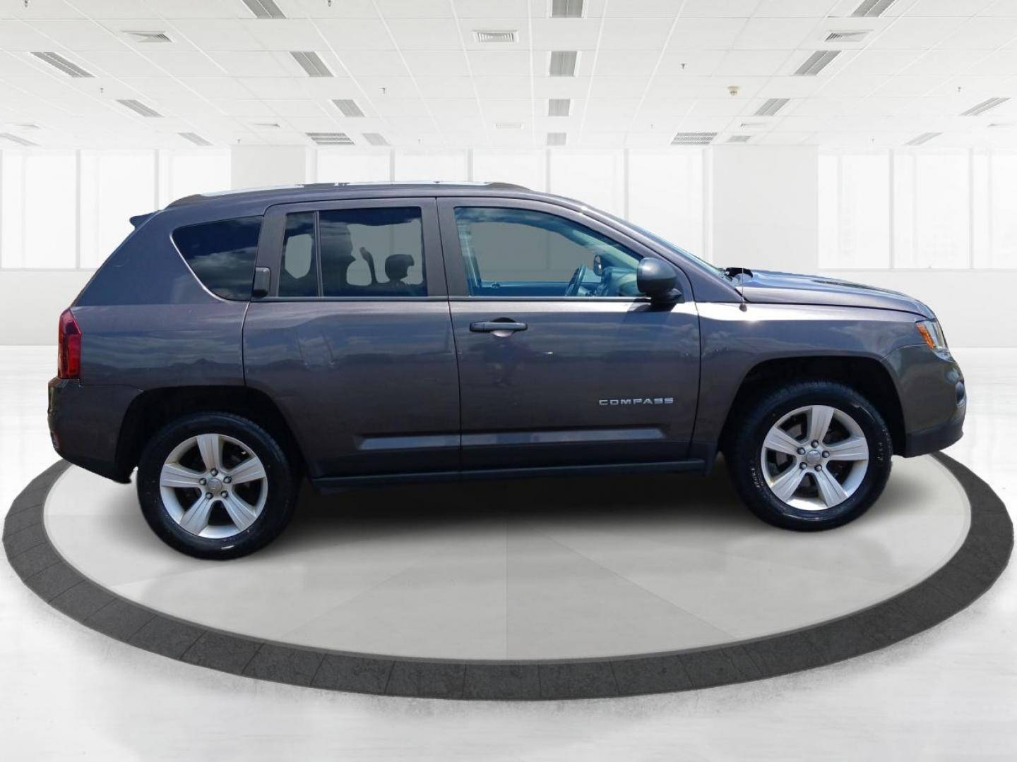 2015 Granite Crystal Metallic Clear Coat Jeep Compass (1C4NJDEB4FD) with an 2.4L L4 DOHC 16V engine, 6-Speed Automatic transmission, located at 1099 N County Rd 25A , Troy, OH, 45373, (937) 908-9800, 40.057079, -84.212883 - Photo#1