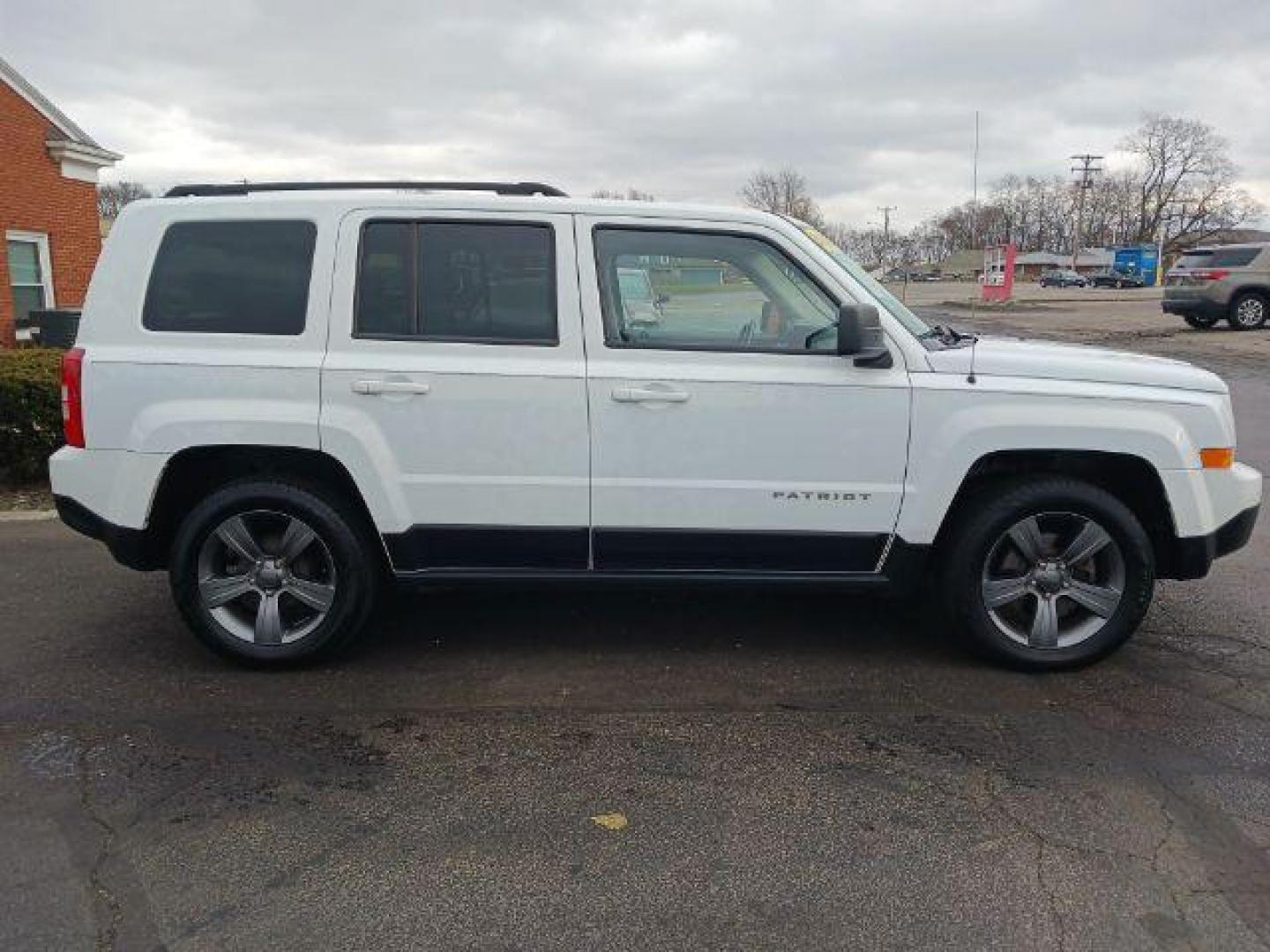 2015 Bright White Clearcoat Jeep Patriot Latitude 2WD (1C4NJPFA8FD) with an 2.0L L4 DOHC 16V engine, located at 4508 South Dixie Dr, Moraine, OH, 45439, (937) 908-9800, 39.689976, -84.218452 - Photo#4