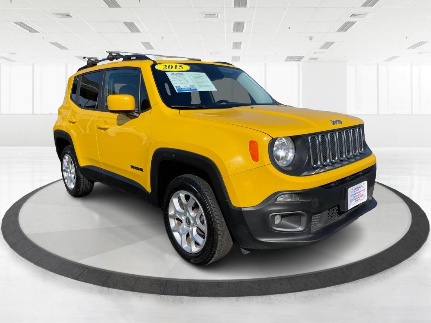 2015 Solar Yellow Jeep Renegade Latitude 4WD (ZACCJBBT3FP) with an 2.4L L4 engine, 6-Speed Manual transmission, located at 1184 Kauffman Ave, Fairborn, OH, 45324, (937) 908-9800, 39.807072, -84.030914 - Photo#0