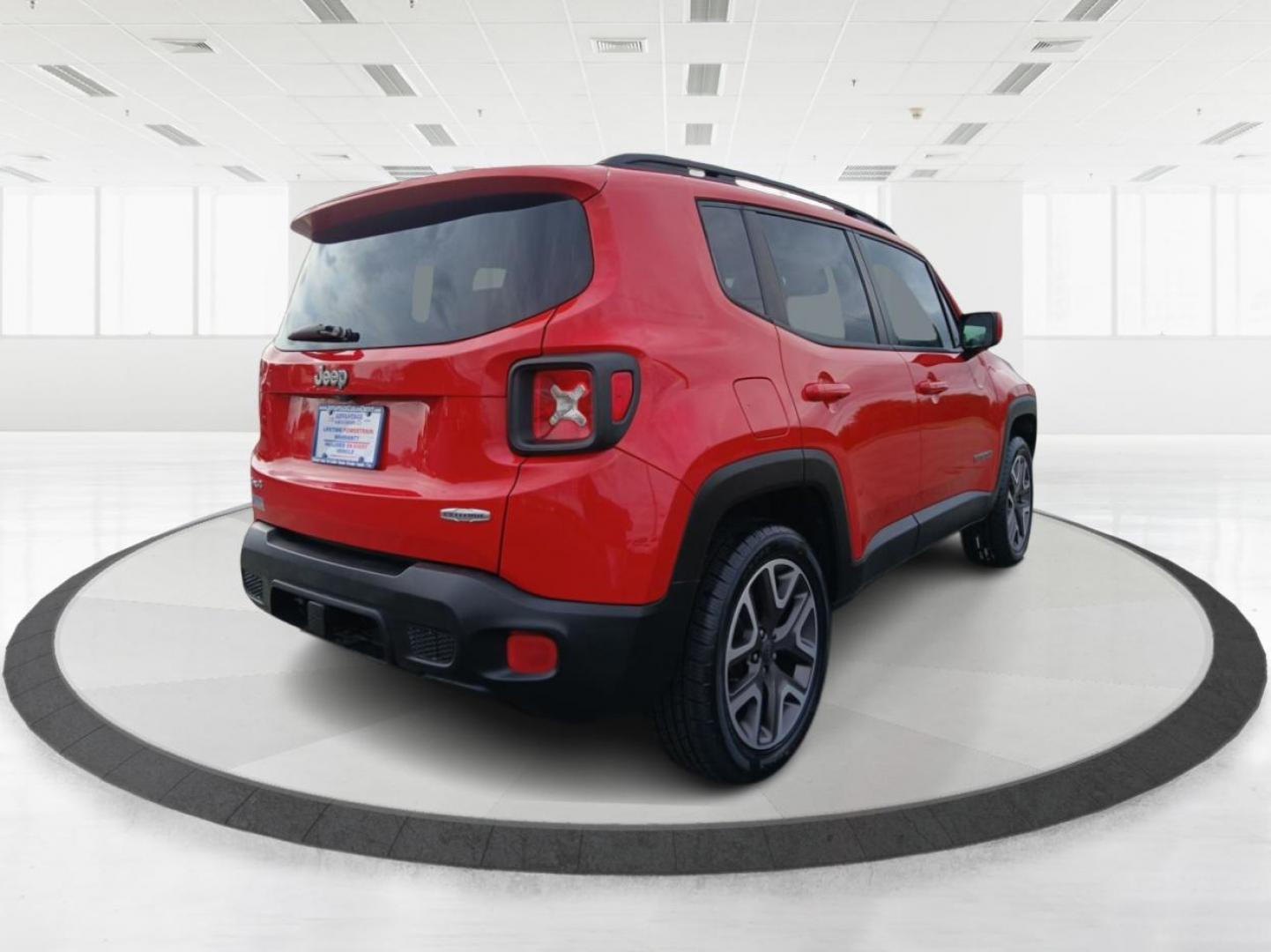 2015 Colorado Red Jeep Renegade Latitude 4WD (ZACCJBBT2FP) with an 2.4L L4 engine, 6-Speed Manual transmission, located at 8750 N County Rd 25A, Piqua, OH, 45356, (937) 908-9800, 40.164391, -84.232513 - Photo#2