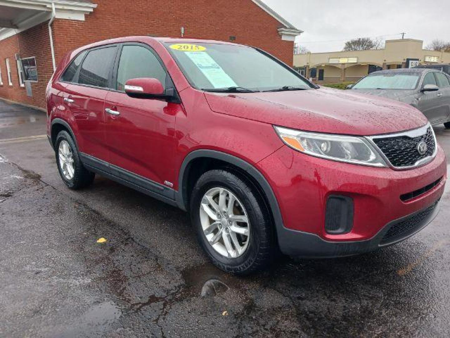 2015 Remington Red Metallic Kia Sorento LX AWD (5XYKTCA66FG) with an 2.4L L4 DOHC 16V engine, 6-Speed Automatic transmission, located at 1230 East Main St, Xenia, OH, 45385, (937) 908-9800, 39.688026, -83.910172 - Photo#0