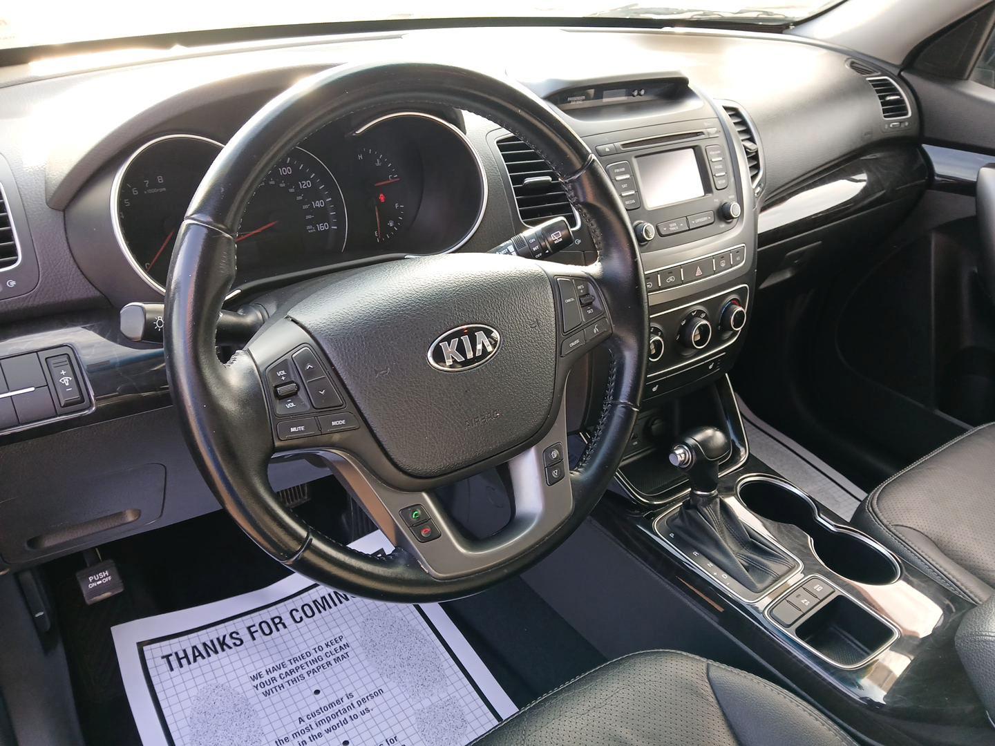 2015 Ebony Black Kia Sorento LX 2WD (5XYKT3A62FG) with an 2.4L L4 DOHC 16V engine, 6-Speed Automatic transmission, located at 401 Woodman Dr, Riverside, OH, 45431, (937) 908-9800, 39.760899, -84.123421 - 2015 Kia Sorento LX 2WD - Photo#8