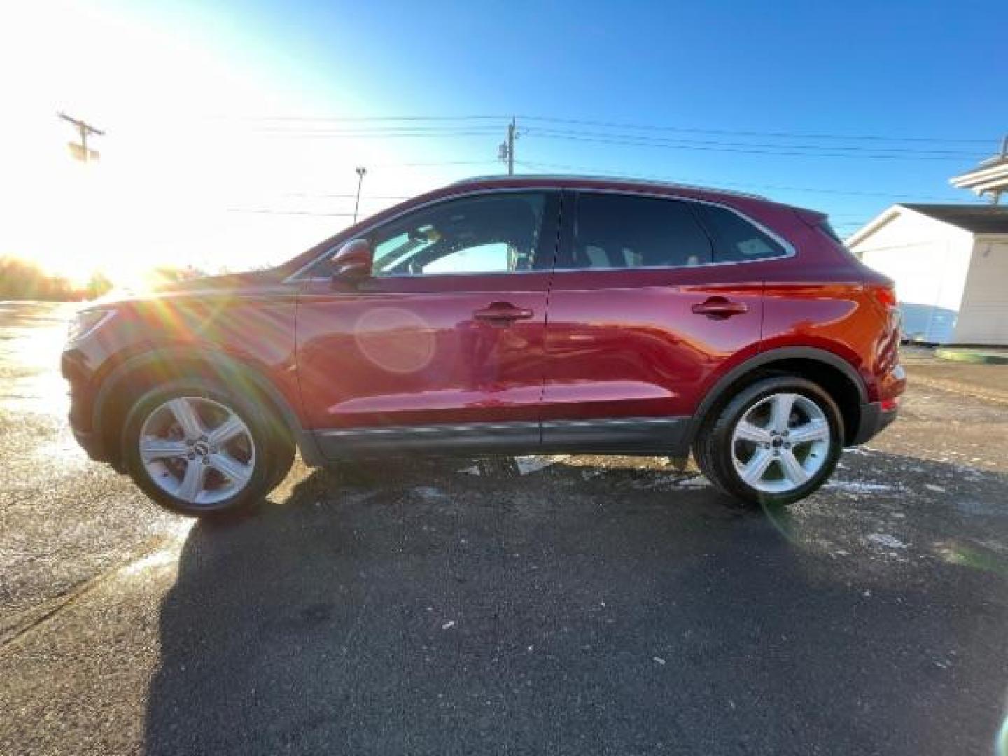 2015 Ruby Red Met Tinted CC Lincoln MKC AWD (5LMCJ2A94FU) with an 2.0L L4 DOHC 16V engine, 6-Speed Automatic transmission, located at 880 E. National Road, Vandalia, OH, 45377, (937) 908-9800, 39.891918, -84.183594 - Photo#4