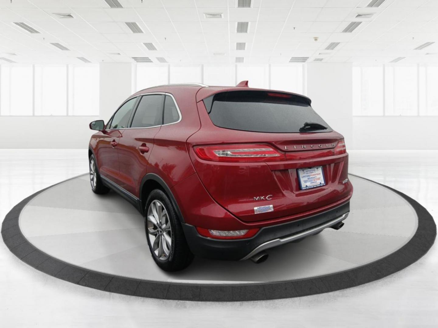 2015 Ruby Red Met Tinted CC Lincoln MKC AWD (5LMCJ2A9XFU) with an 2.0L L4 DOHC 16V engine, 6-Speed Automatic transmission, located at 8750 N County Rd 25A, Piqua, OH, 45356, (937) 908-9800, 40.164391, -84.232513 - Photo#4