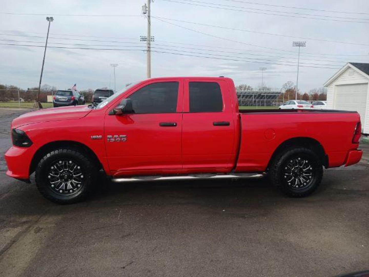 2015 Red RAM 1500 Tradesman Quad Cab 4WD (1C6RR7FT3FS) with an 5.7L V8 OHV 16V engine, 8-Speed Automatic transmission, located at 1184 Kauffman Ave, Fairborn, OH, 45324, (937) 908-9800, 39.807072, -84.030914 - Photo#3