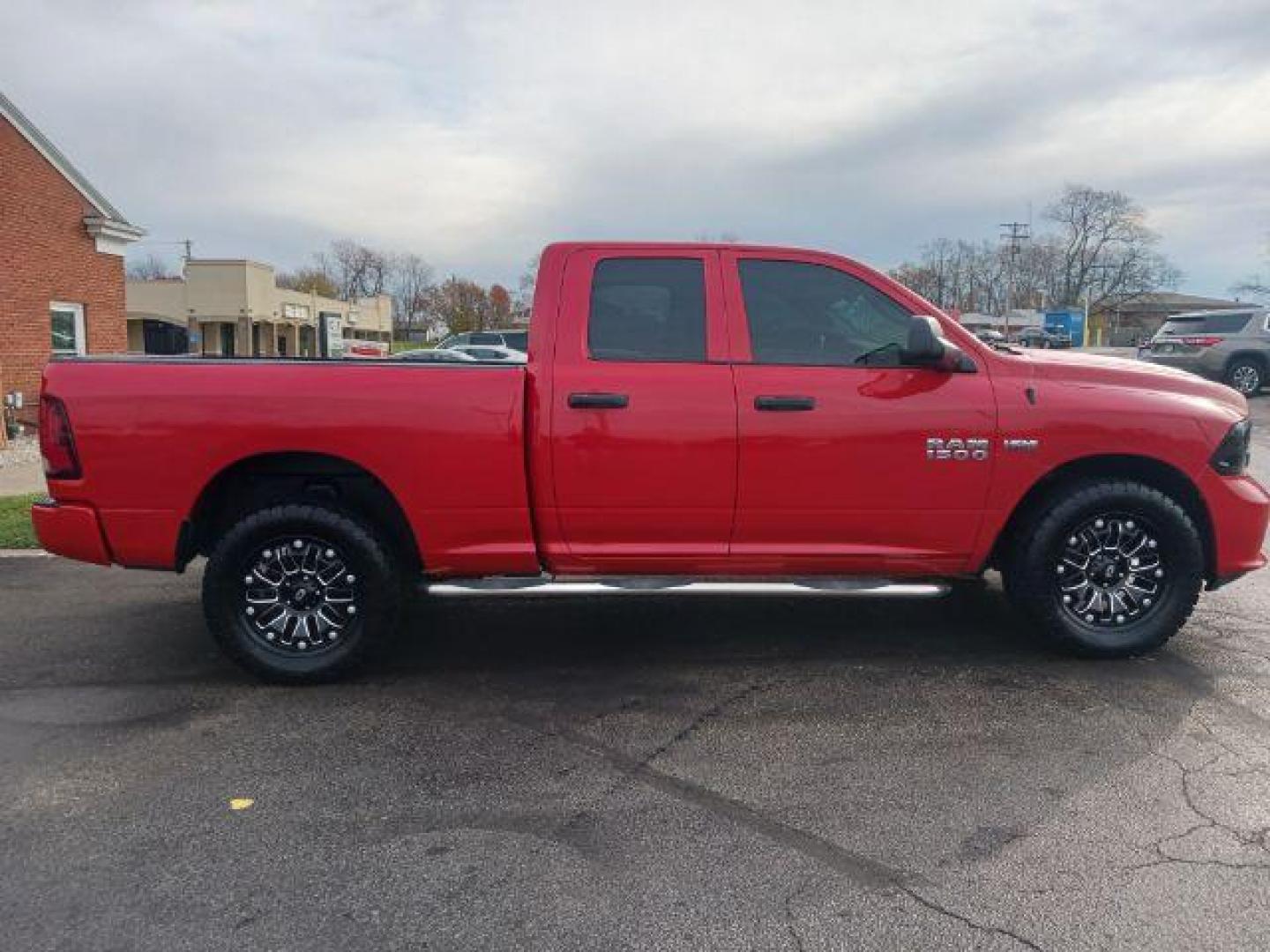 2015 Red RAM 1500 Tradesman Quad Cab 4WD (1C6RR7FT3FS) with an 5.7L V8 OHV 16V engine, 8-Speed Automatic transmission, located at 1184 Kauffman Ave, Fairborn, OH, 45324, (937) 908-9800, 39.807072, -84.030914 - Photo#4