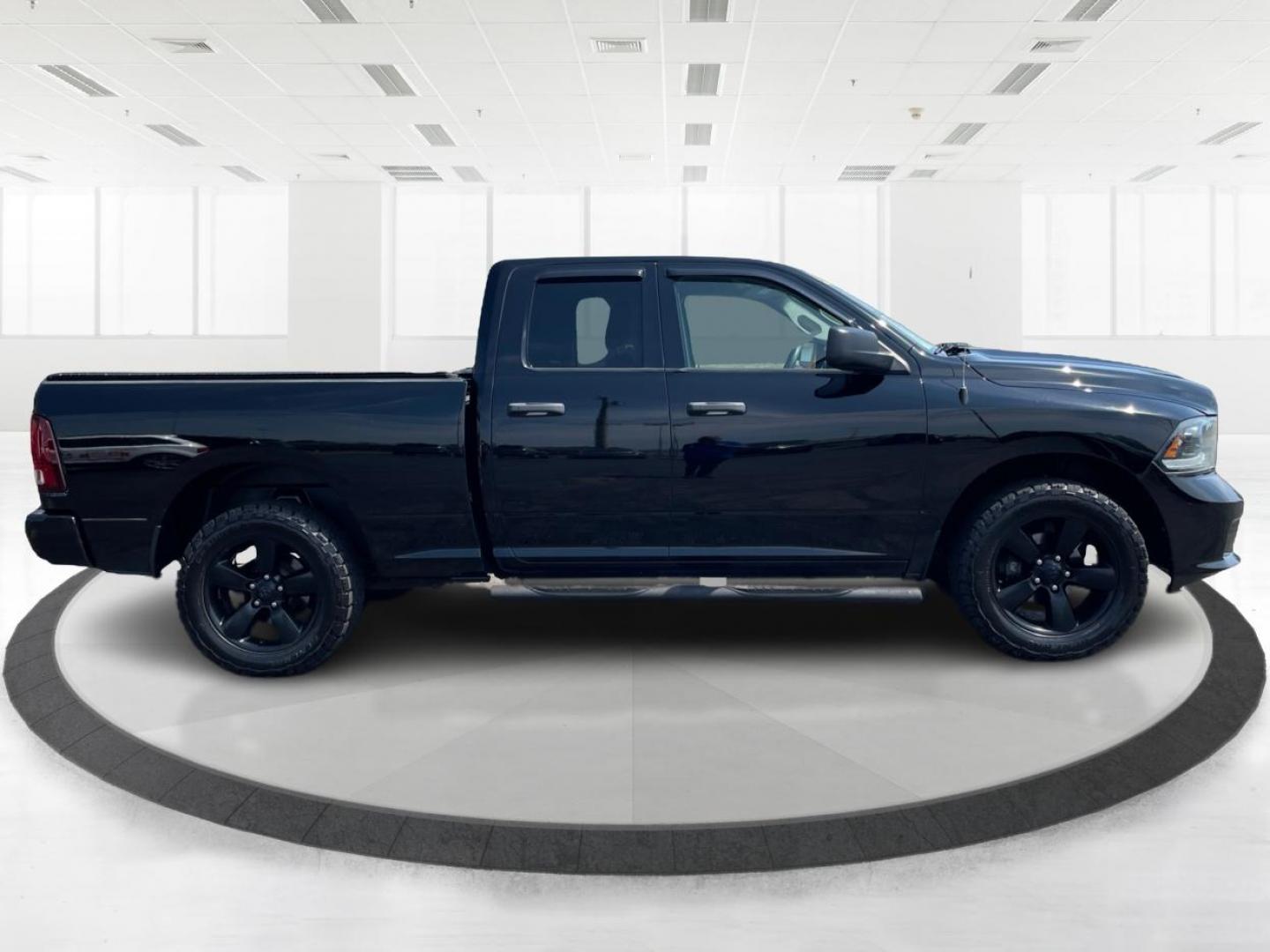 2015 Black RAM 1500 Tradesman Quad Cab 4WD (1C6RR7FTXFS) with an 5.7L V8 OHV 16V engine, 6-Speed Automatic transmission, located at 1184 Kauffman Ave, Fairborn, OH, 45324, (937) 908-9800, 39.807072, -84.030914 - Photo#1