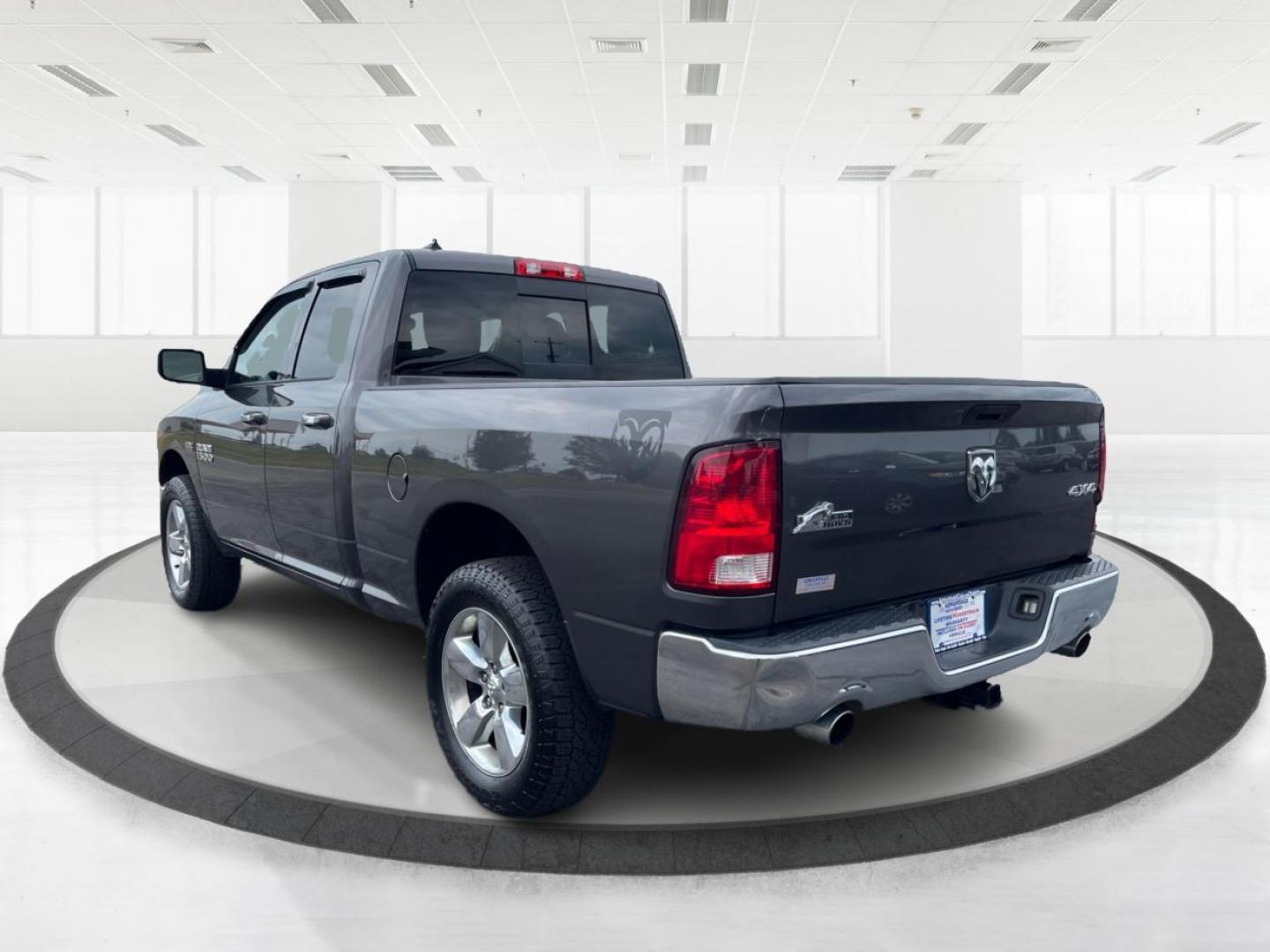 2015 Gray RAM 1500 SLT Quad Cab 4WD (1C6RR7GT3FS) with an 5.7L V8 OHV 16V engine, 8-Speed Automatic transmission, located at 1951 S Dayton Lakeview Rd., New Carlisle, OH, 45344, (937) 908-9800, 39.890999, -84.050255 - Photo#4