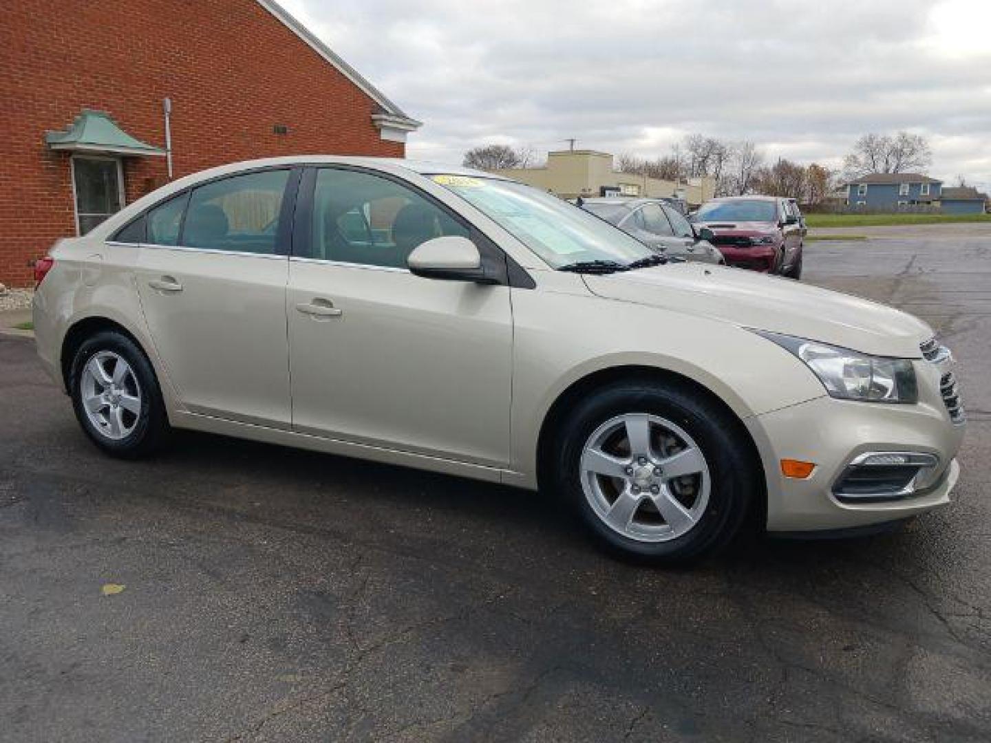 2016 Gold Chevrolet Cruze Limited 1LT Auto (1G1PE5SB0G7) with an 1.4L L4 DOHC 16V TURBO engine, 6-Speed Automatic transmission, located at 1951 S Dayton Lakeview Rd., New Carlisle, OH, 45344, (937) 908-9800, 39.890999, -84.050255 - Photo#0