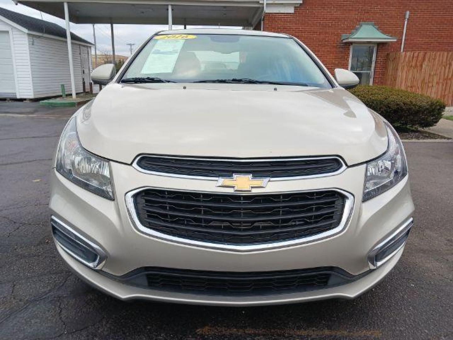 2016 Gold Chevrolet Cruze Limited 1LT Auto (1G1PE5SB0G7) with an 1.4L L4 DOHC 16V TURBO engine, 6-Speed Automatic transmission, located at 1951 S Dayton Lakeview Rd., New Carlisle, OH, 45344, (937) 908-9800, 39.890999, -84.050255 - Photo#1