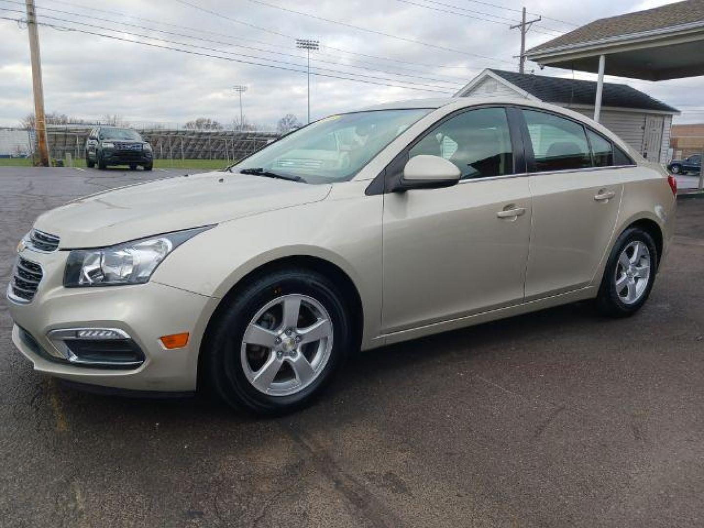 2016 Gold Chevrolet Cruze Limited 1LT Auto (1G1PE5SB0G7) with an 1.4L L4 DOHC 16V TURBO engine, 6-Speed Automatic transmission, located at 1951 S Dayton Lakeview Rd., New Carlisle, OH, 45344, (937) 908-9800, 39.890999, -84.050255 - Photo#2