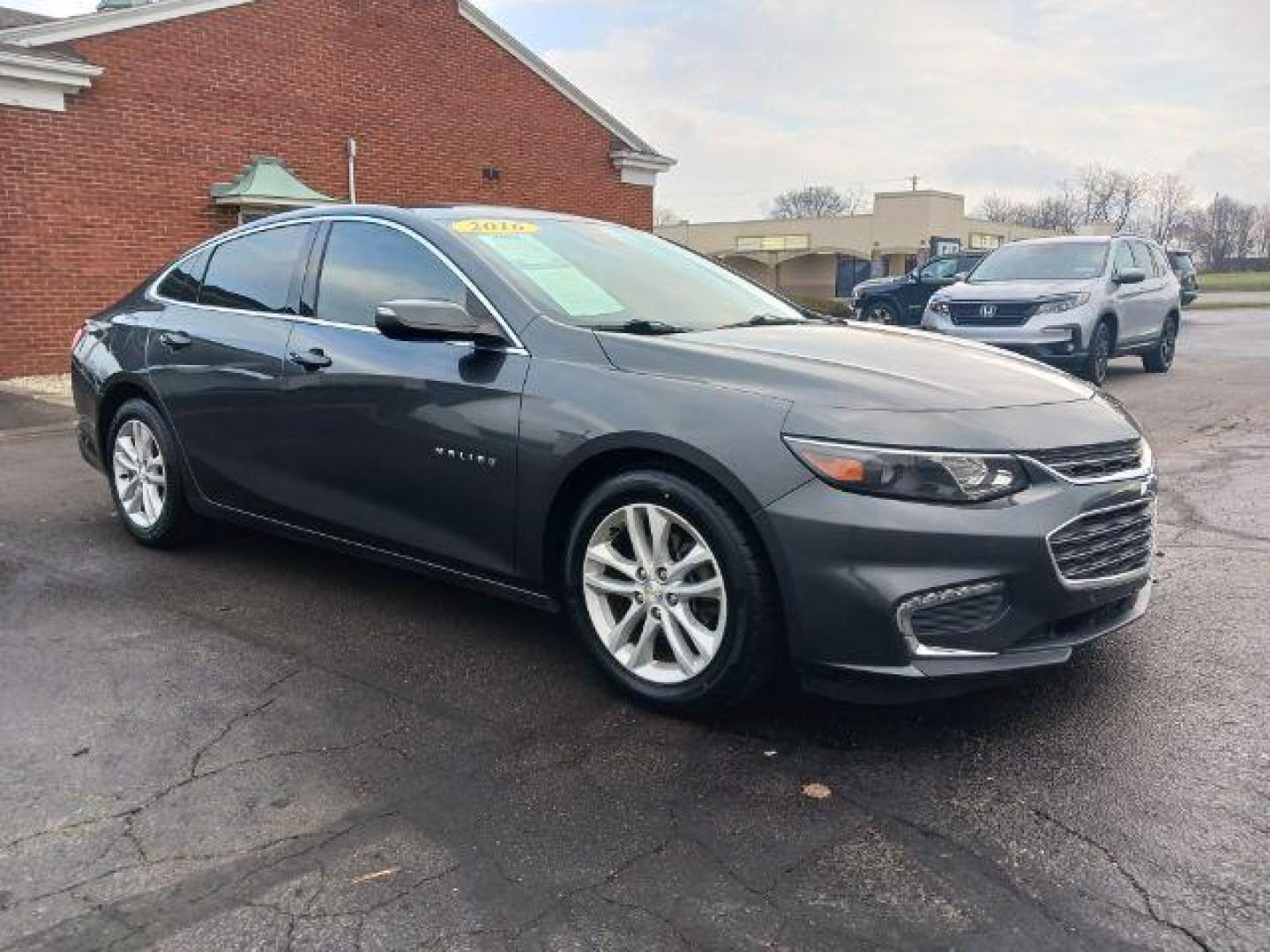 2016 Mosaic Black Metallic Chevrolet Malibu 1LT (1G1ZE5ST7GF) with an 1.5L L4 DOHC 16V engine, 6-Speed Automatic transmission, located at 880 E. National Road, Vandalia, OH, 45377, (937) 908-9800, 39.891918, -84.183594 - Photo#0