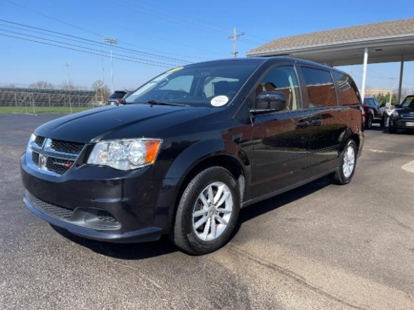 2016 Brilliant Black Crystal Pearl Coat Dodge Grand Caravan SXT (2C4RDGCG1GR) with an 3.6L V6 DOHC 24V engine, 6-Speed Automatic transmission, located at 401 Woodman Dr, Riverside, OH, 45431, (937) 908-9800, 39.760899, -84.123421 - Photo#1