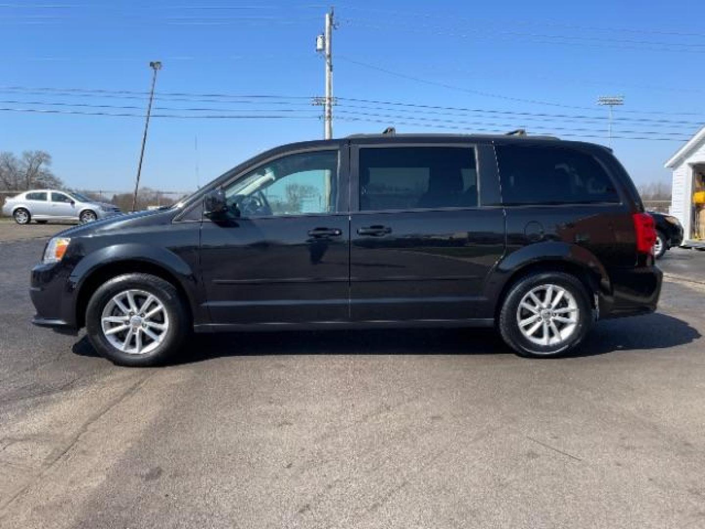 2016 Brilliant Black Crystal Pearl Coat Dodge Grand Caravan SXT (2C4RDGCG1GR) with an 3.6L V6 DOHC 24V engine, 6-Speed Automatic transmission, located at 401 Woodman Dr, Riverside, OH, 45431, (937) 908-9800, 39.760899, -84.123421 - Photo#2