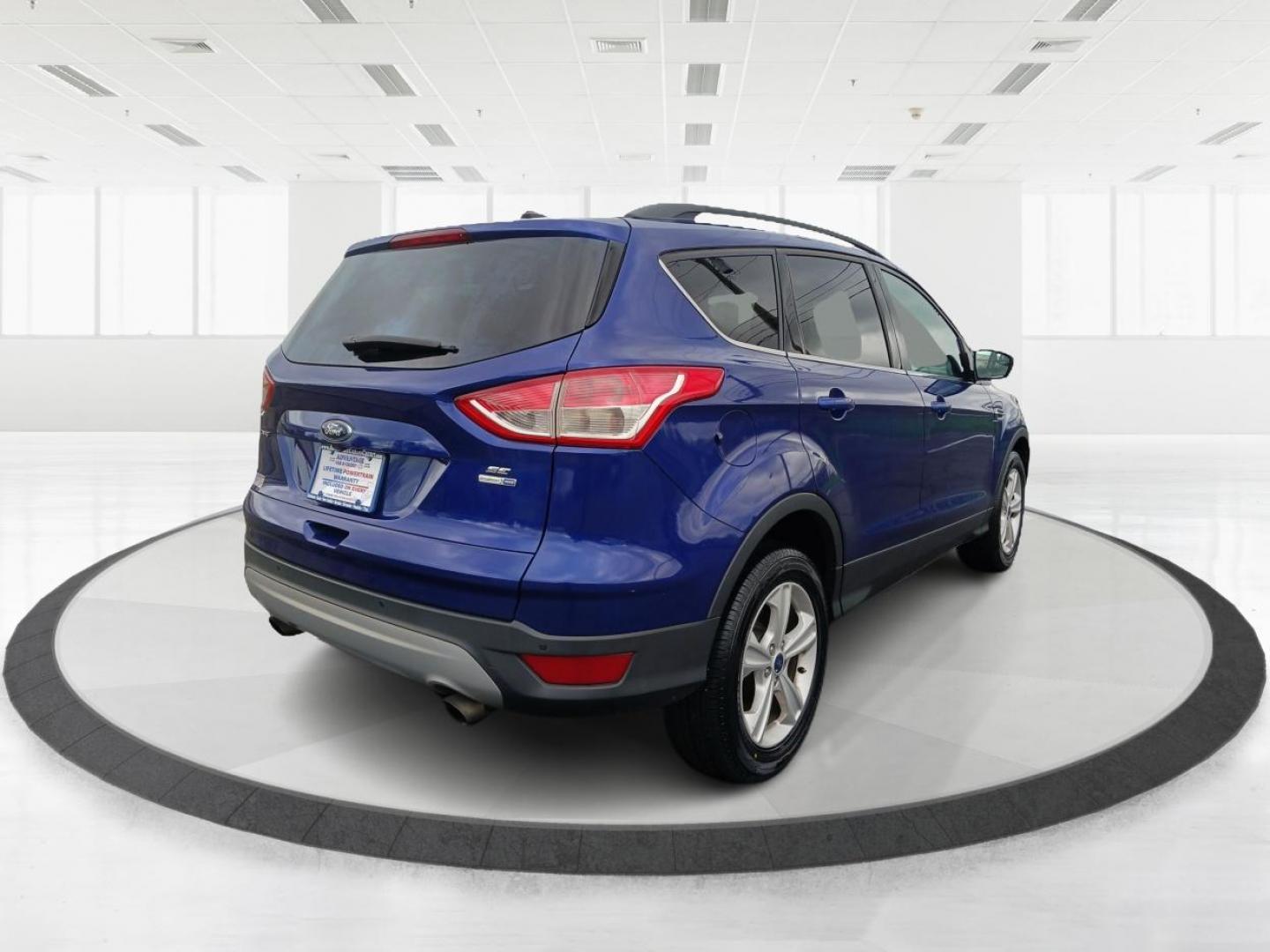 2016 Deep Impact Blue Metallic Ford Escape SE 4WD (1FMCU9G9XGU) with an 2.0L L4 DOHC 16V engine, 6-Speed Automatic transmission, located at 4508 South Dixie Dr, Moraine, OH, 45439, (937) 908-9800, 39.689976, -84.218452 - Photo#2