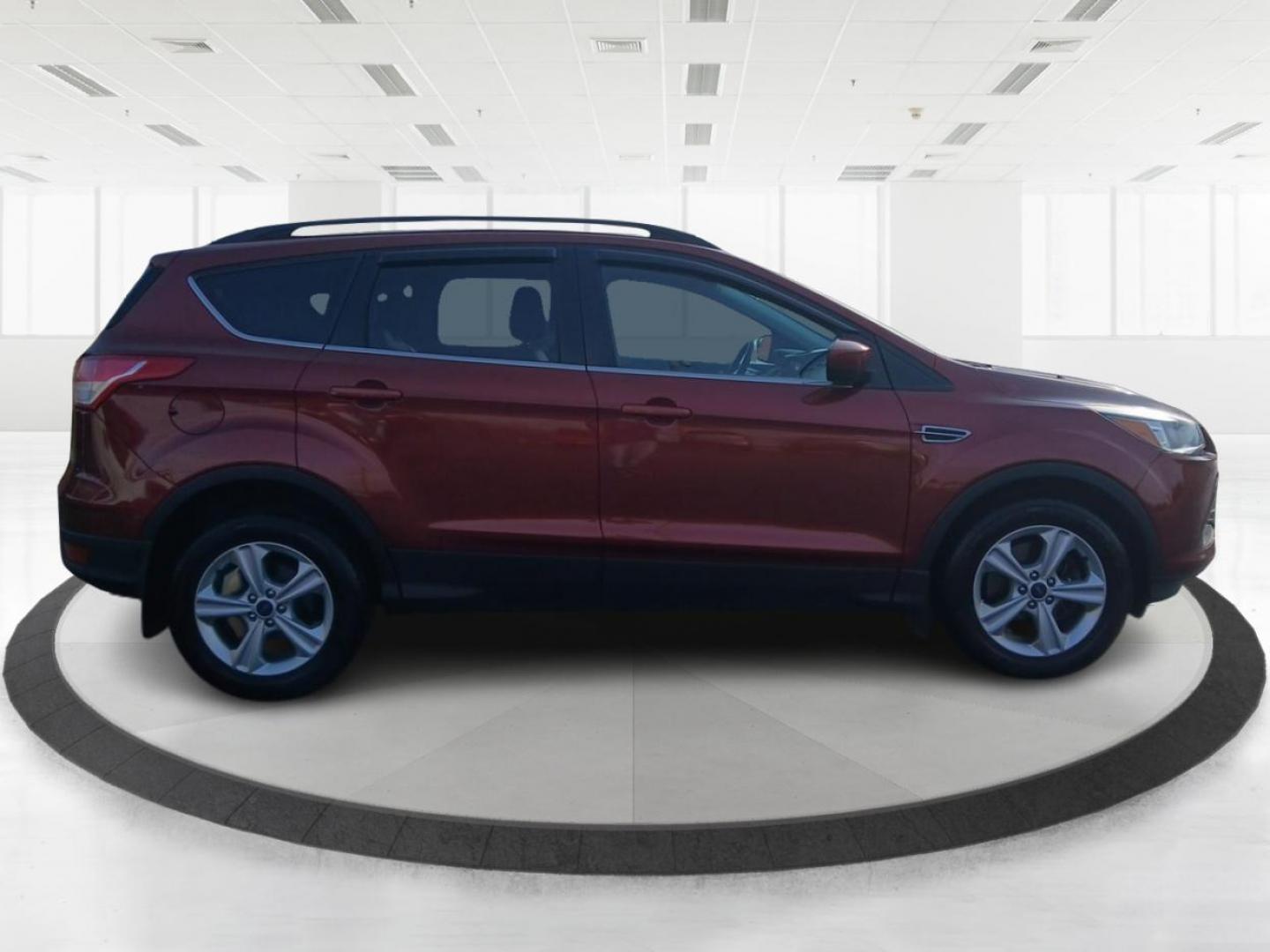 2016 Sunset Metallic Ford Escape SE 4WD (1FMCU9G95GU) with an 2.0L L4 DOHC 16V engine, 6-Speed Automatic transmission, located at 4508 South Dixie Dr, Moraine, OH, 45439, (937) 908-9800, 39.689976, -84.218452 - Photo#0