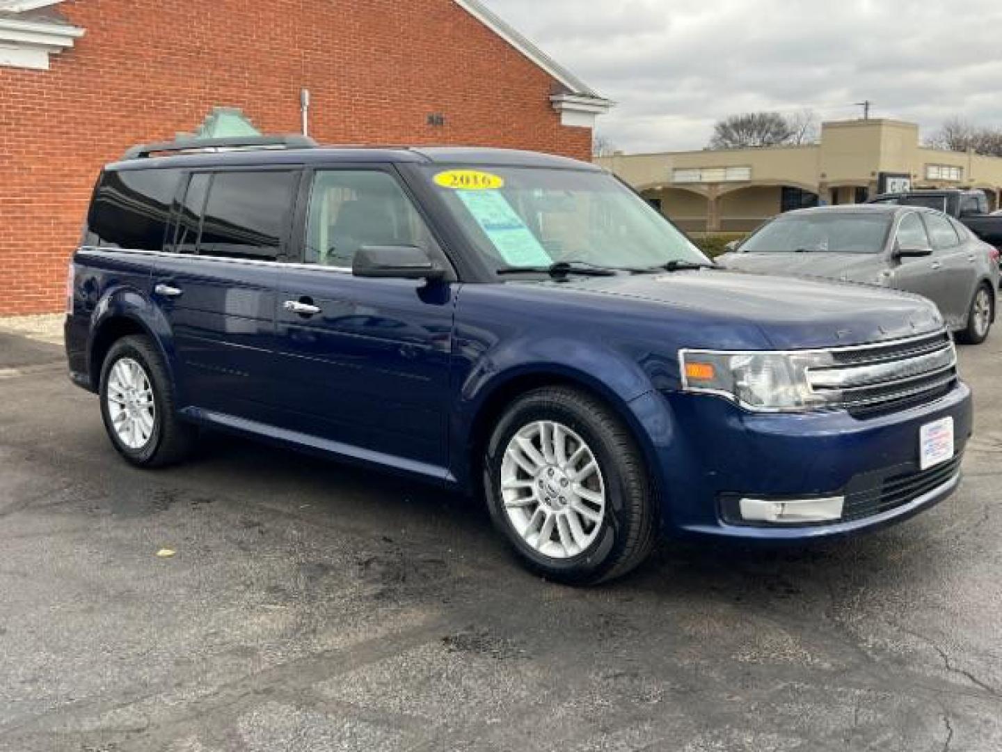 2016 Kona Blue Metallic Ford Flex SEL AWD (2FMHK6C86GB) with an 3.5L V6 DOHC 24V engine, 6-Speed Automatic Overdrive transmission, located at 1184 Kauffman Ave, Fairborn, OH, 45324, (937) 908-9800, 39.807072, -84.030914 - Photo#0