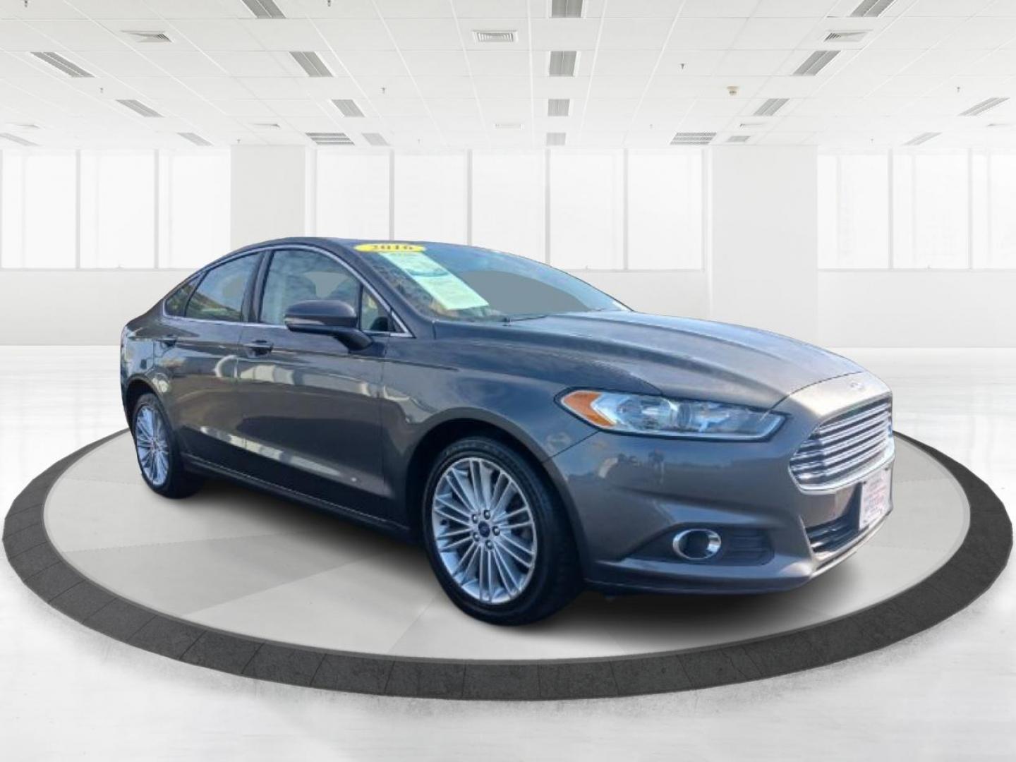 2016 Shadow Black Ford Fusion (3FA6P0T99GR) with an 2.0L L4 DOHC 16V engine, 6-Speed Automatic transmission, located at 1099 N County Rd 25A , Troy, OH, 45373, (937) 908-9800, 40.057079, -84.212883 - Photo#0