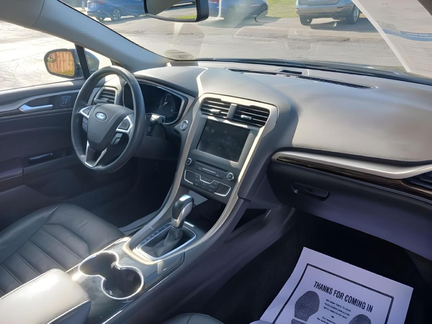 2016 Shadow Black Ford Fusion (3FA6P0T99GR) with an 2.0L L4 DOHC 16V engine, 6-Speed Automatic transmission, located at 1099 N County Rd 25A , Troy, OH, 45373, (937) 908-9800, 40.057079, -84.212883 - Photo#7