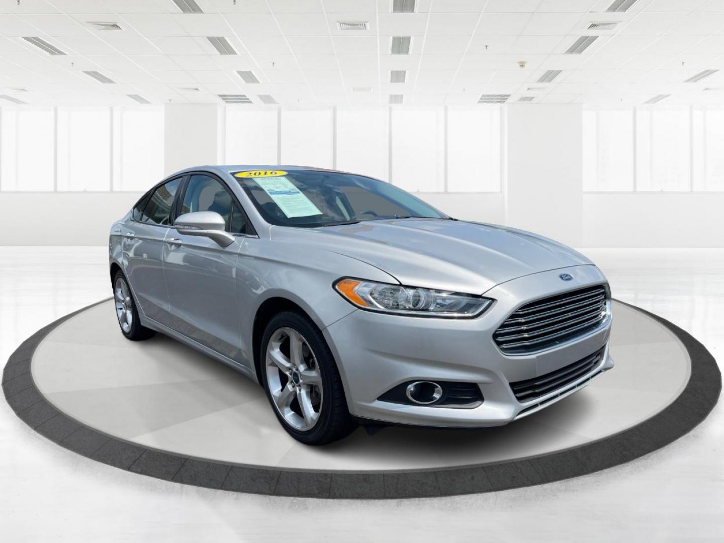 2016 Ingot Silver Metallic Ford Fusion (3FA6P0T90GR) with an 2.0L L4 DOHC 16V engine, 6-Speed Automatic transmission, located at 1184 Kauffman Ave, Fairborn, OH, 45324, (937) 908-9800, 39.807072, -84.030914 - Photo#0