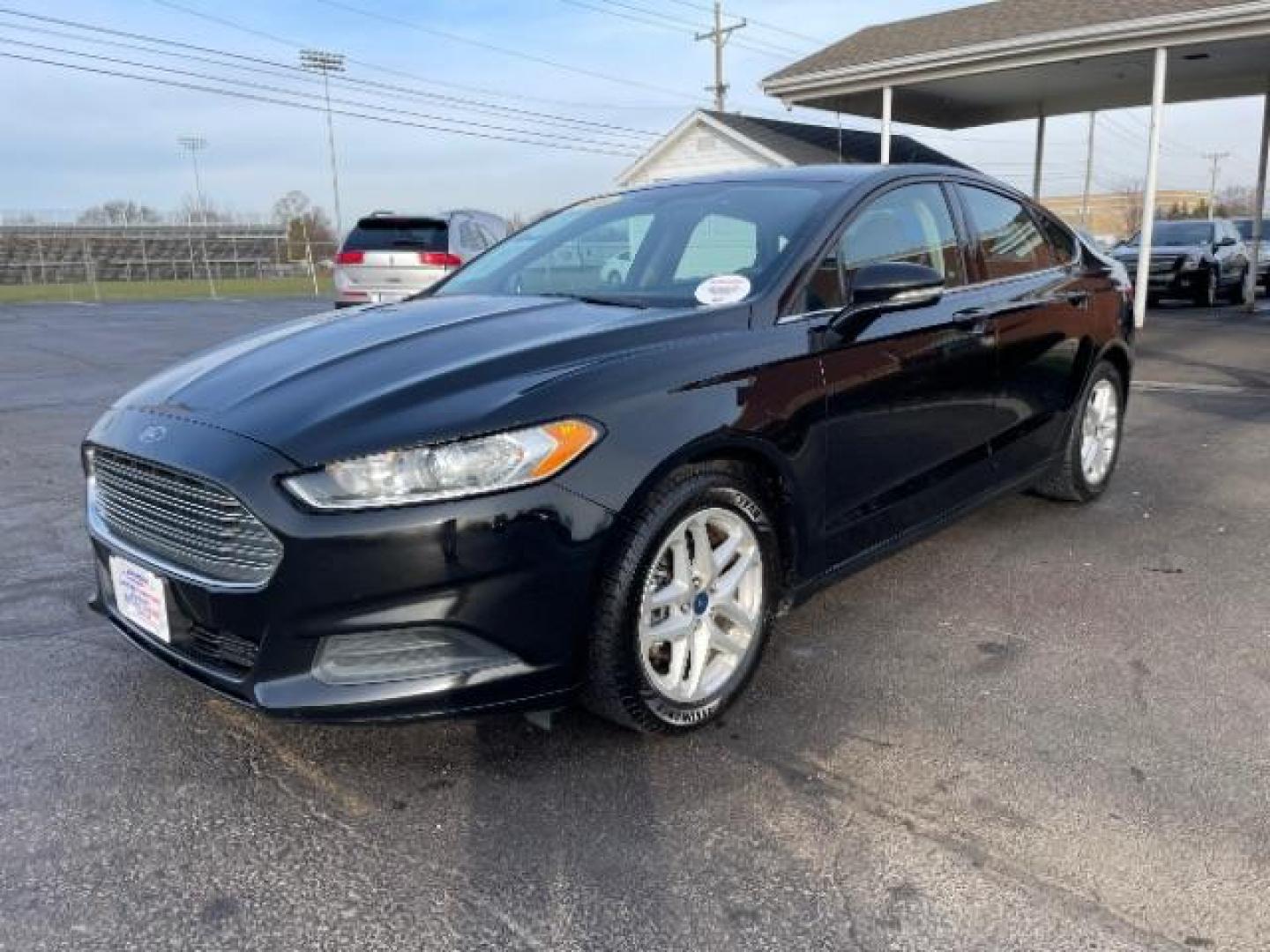 2016 Shadow Black Ford Fusion SE (3FA6P0H72GR) with an 2.5L L4 DOHC 16V engine, 6-Speed Automatic transmission, located at 1230 East Main St, Xenia, OH, 45385, (937) 908-9800, 39.688026, -83.910172 - Photo#1