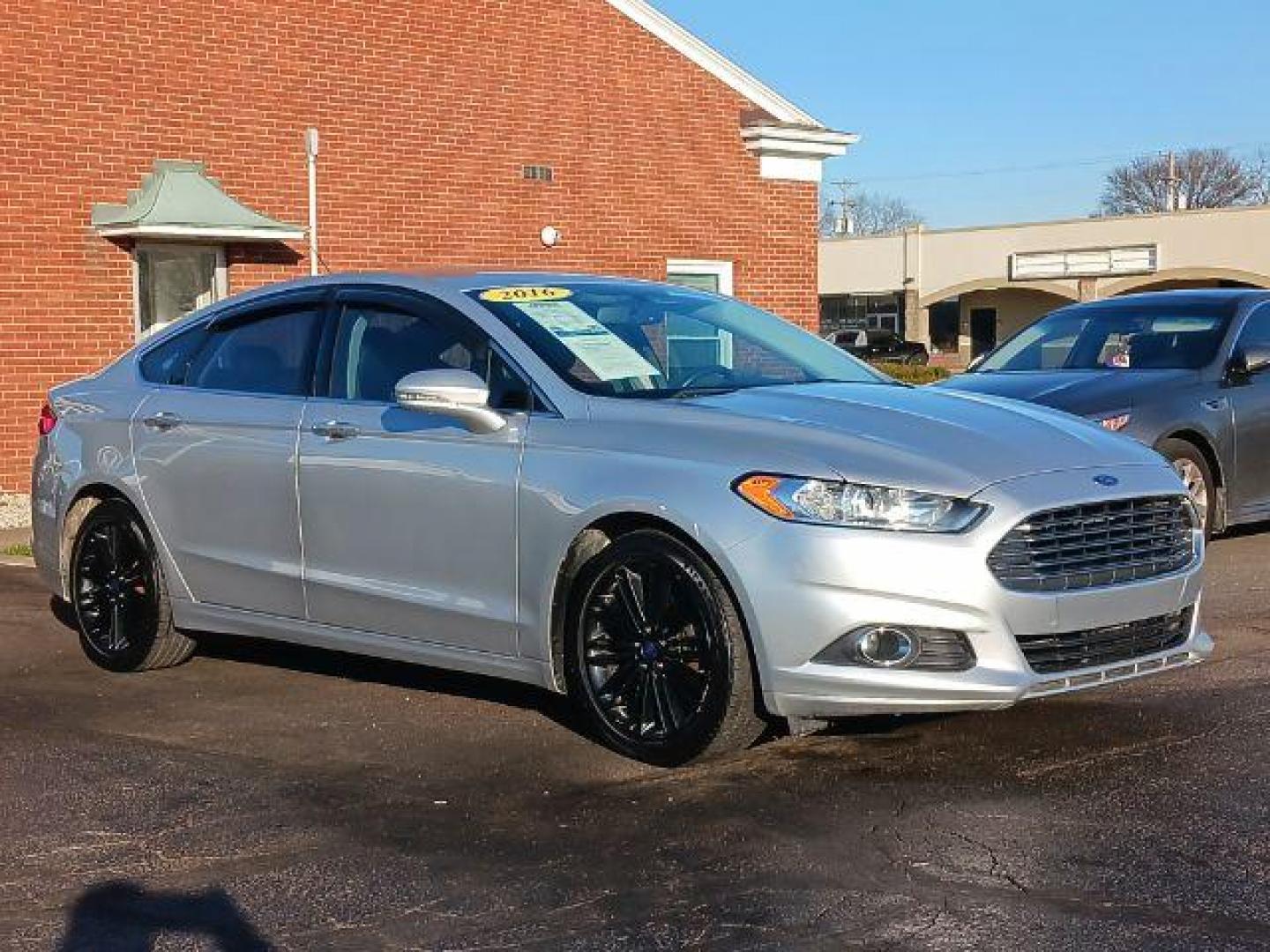 2016 Ingot Silver Metallic Ford Fusion SE (3FA6P0H99GR) with an 2.0L L4 DOHC 16V engine, 6-Speed Automatic transmission, located at 1230 East Main St, Xenia, OH, 45385, (937) 908-9800, 39.688026, -83.910172 - Photo#0